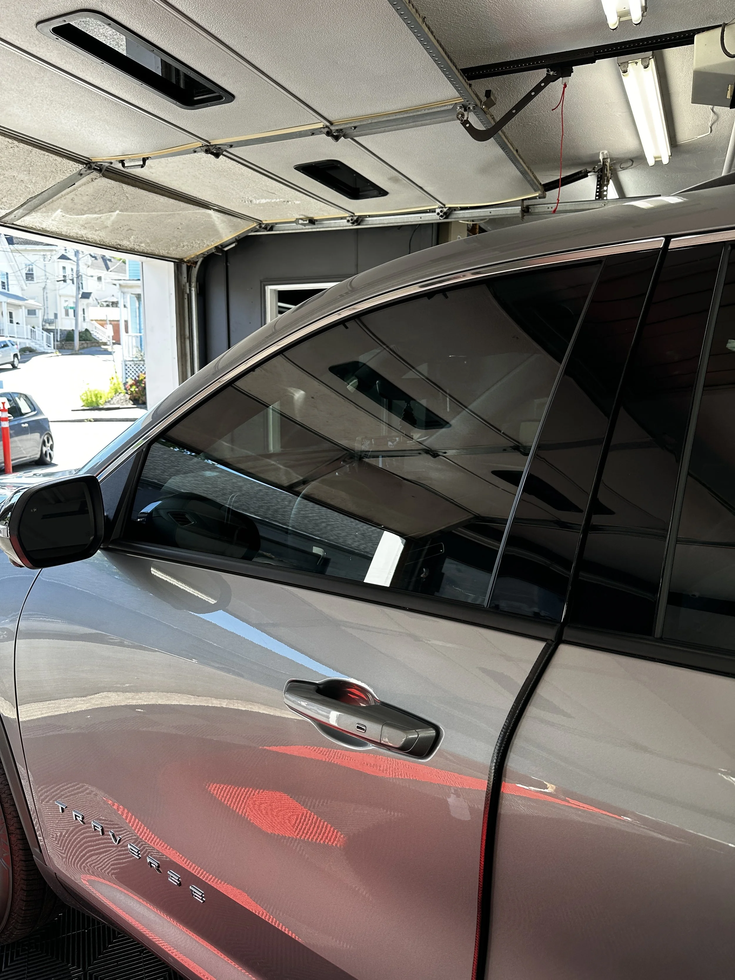 Silver car in the Show Form Studio bay with the door open