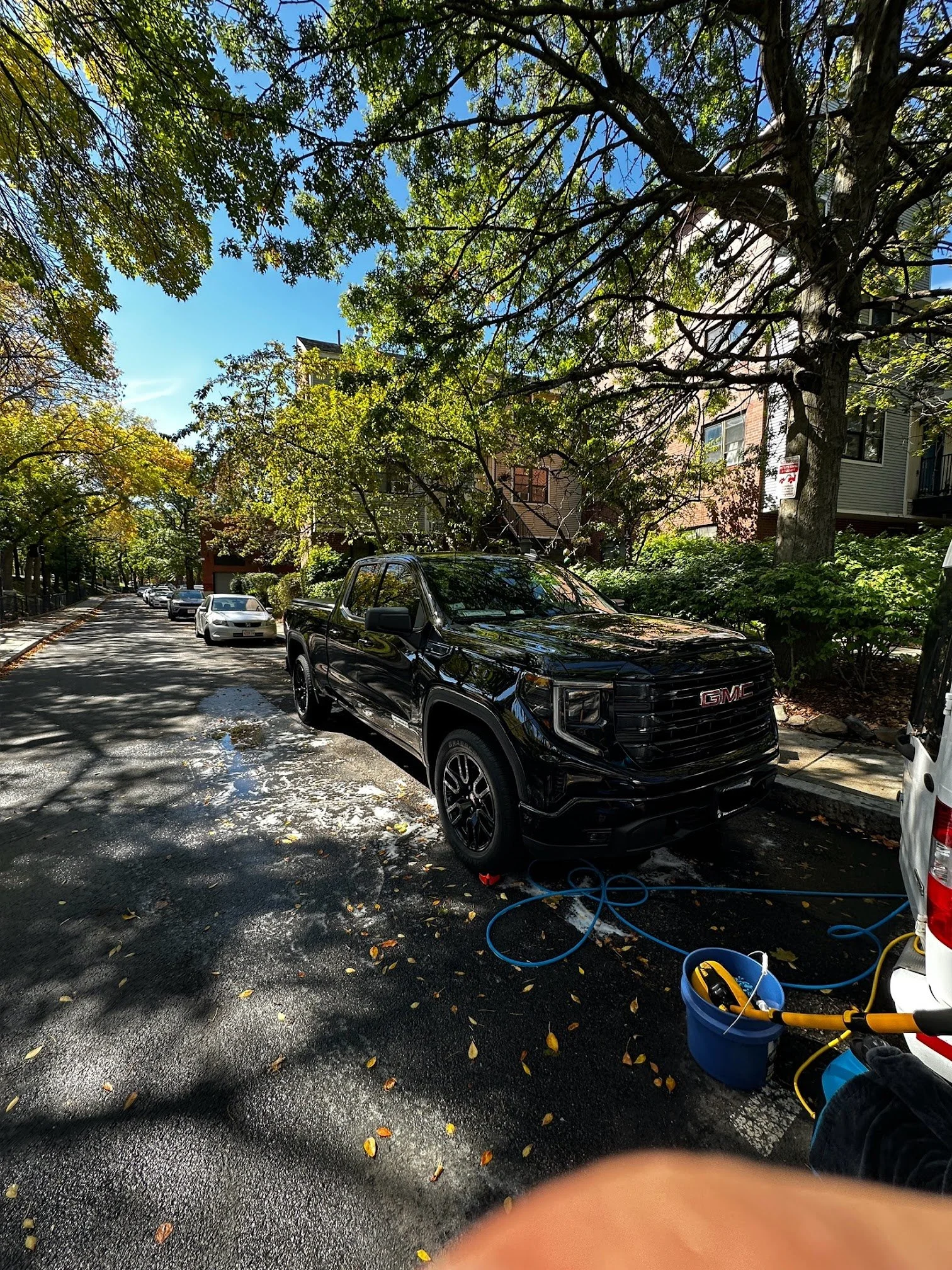 Black GMC truck after a Deep Shine Deluxe exterior detail