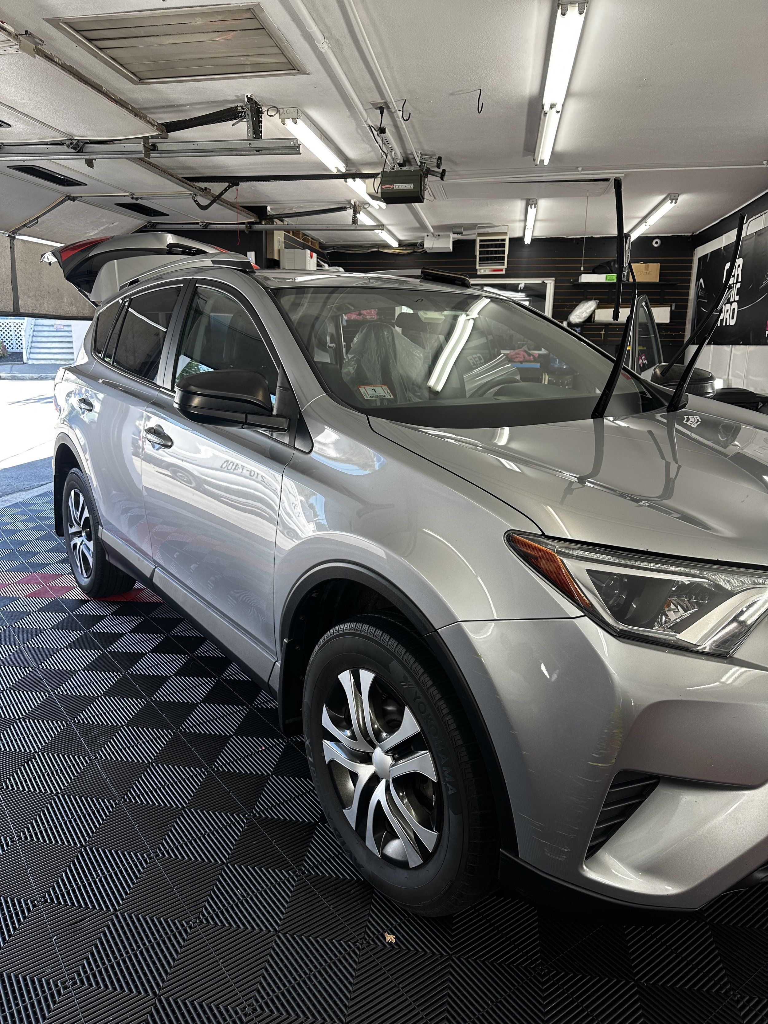 Silver SUV inside the Show Form Studio detailing bay