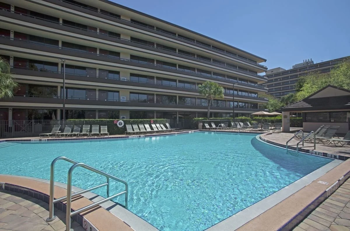 sunbeds-by-the-outdoor-pool-at-rosen-inn-at-pointe-orlando.jpg