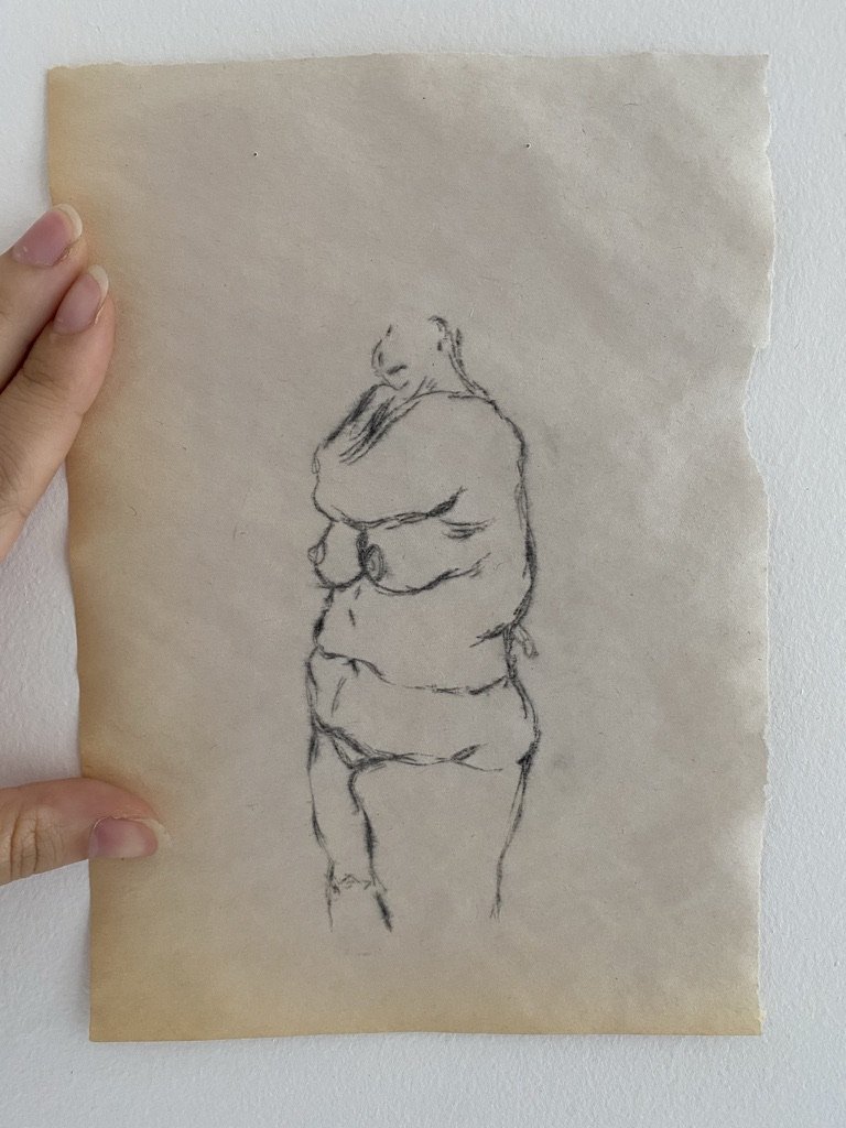 A simple black line drawing of a nude woman from the side.