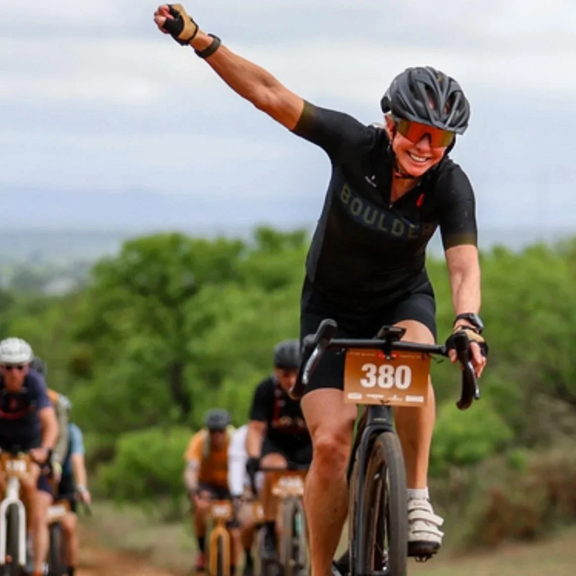Adult 50+ competing in a road bike cycling race.