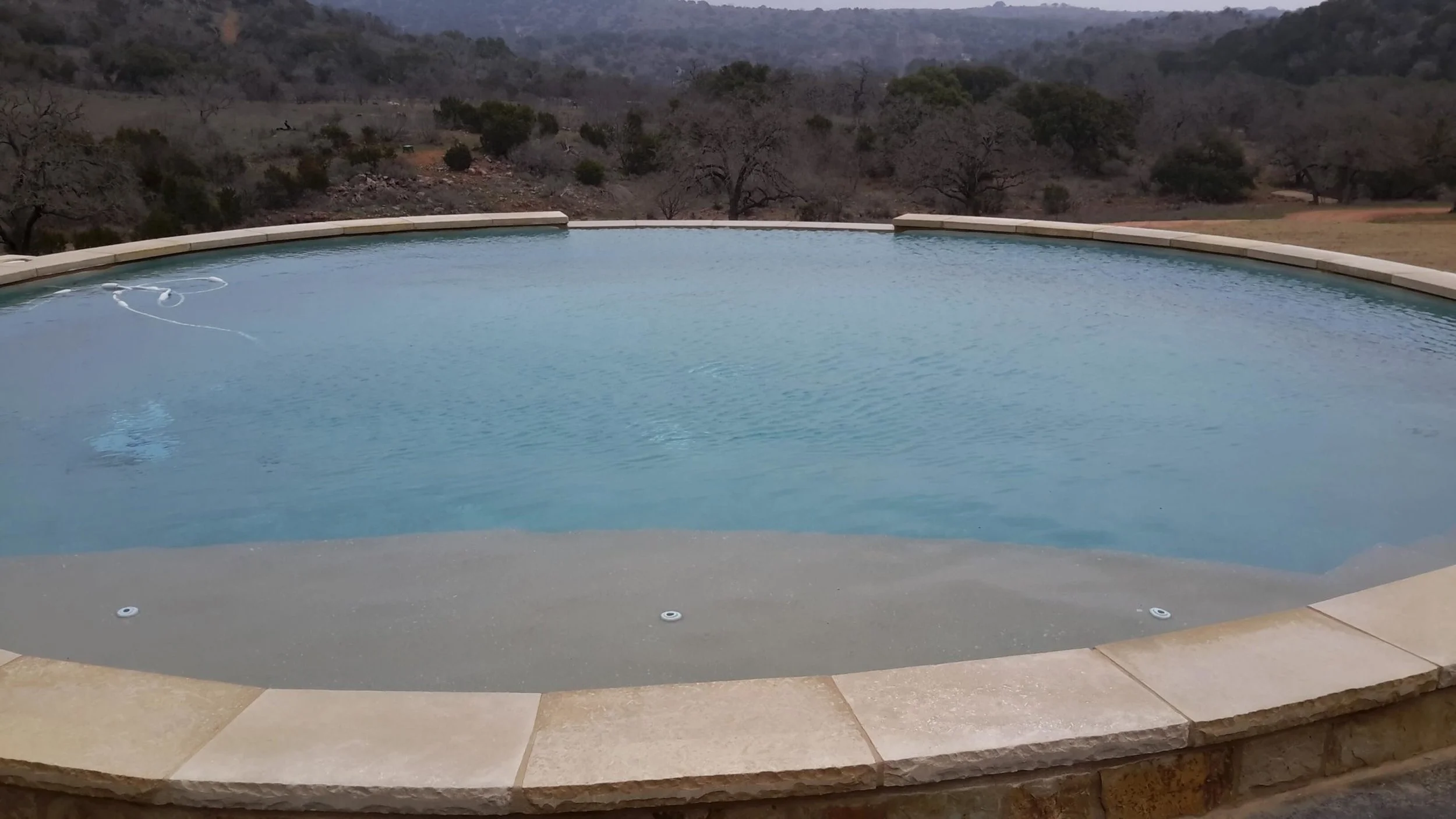 30 ft. INFINITY EDGE WITH ROCK and TANNING LEDGE
