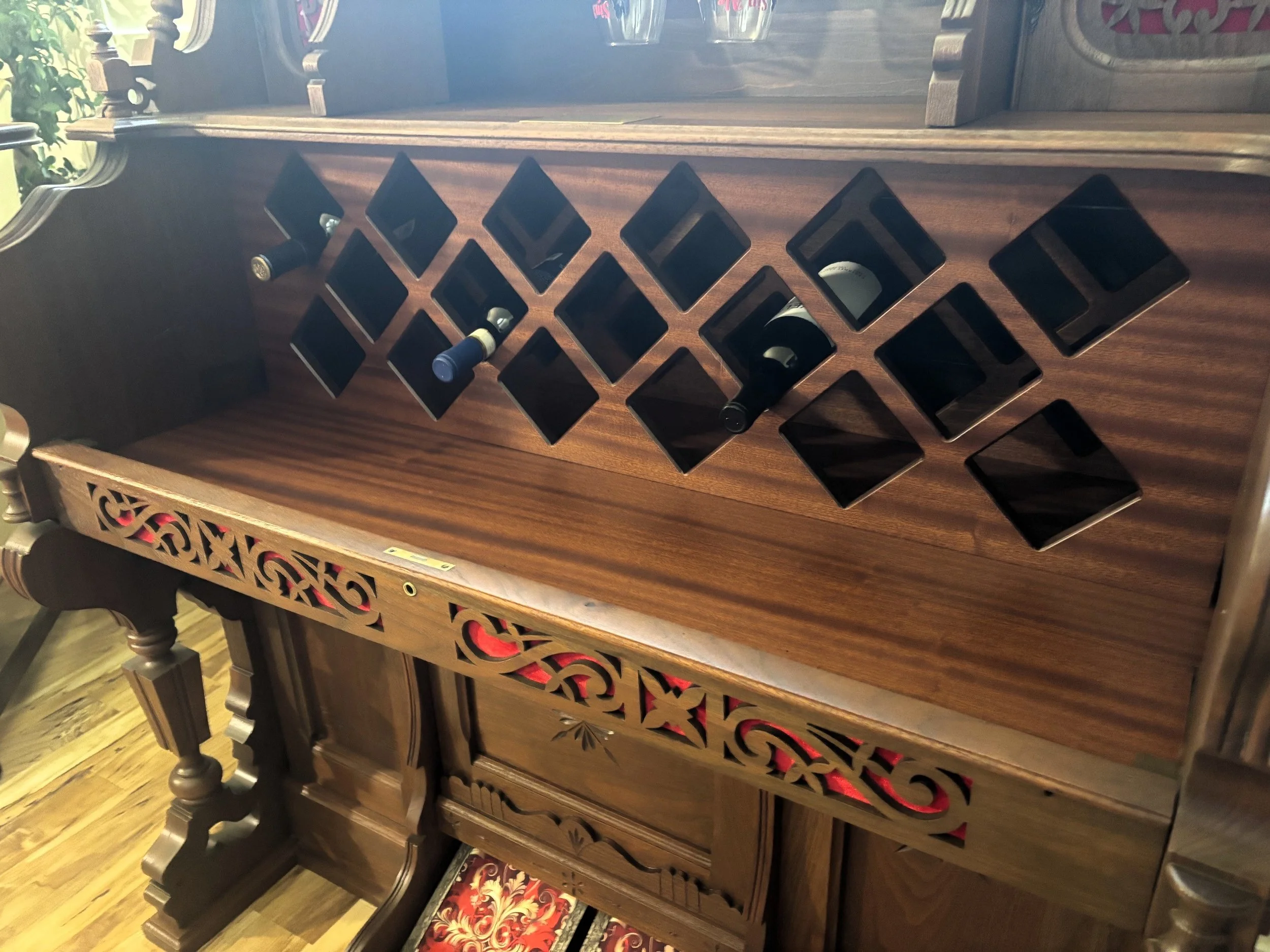 Retired piano repurposed to a wine bar