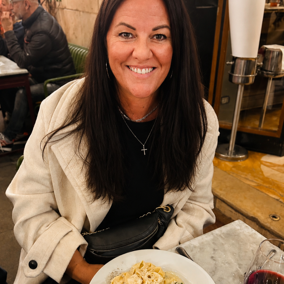 Becki enjoying the pasta she made in Rome, Italy  with new friends