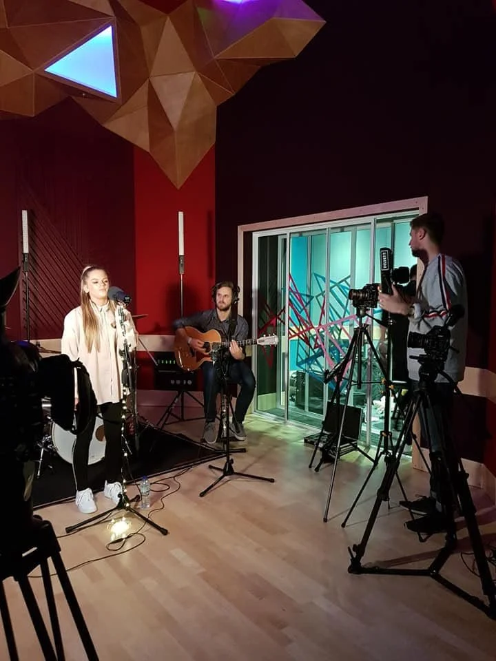 Vocalist working at the microphone during a studio session