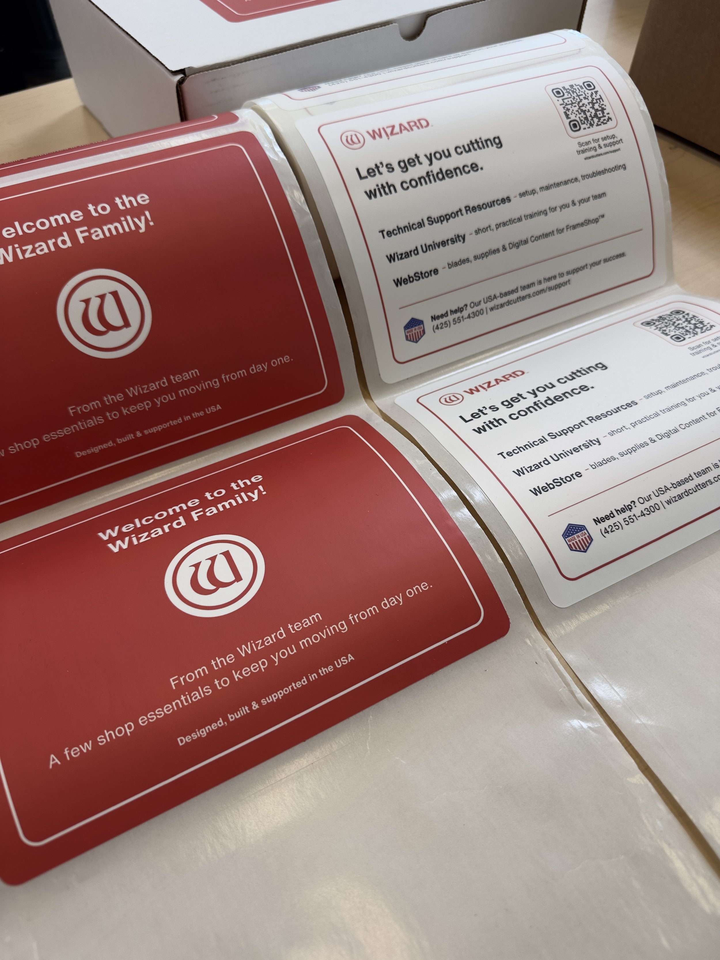 Wizard customer onboarding cards and printed welcome materials.