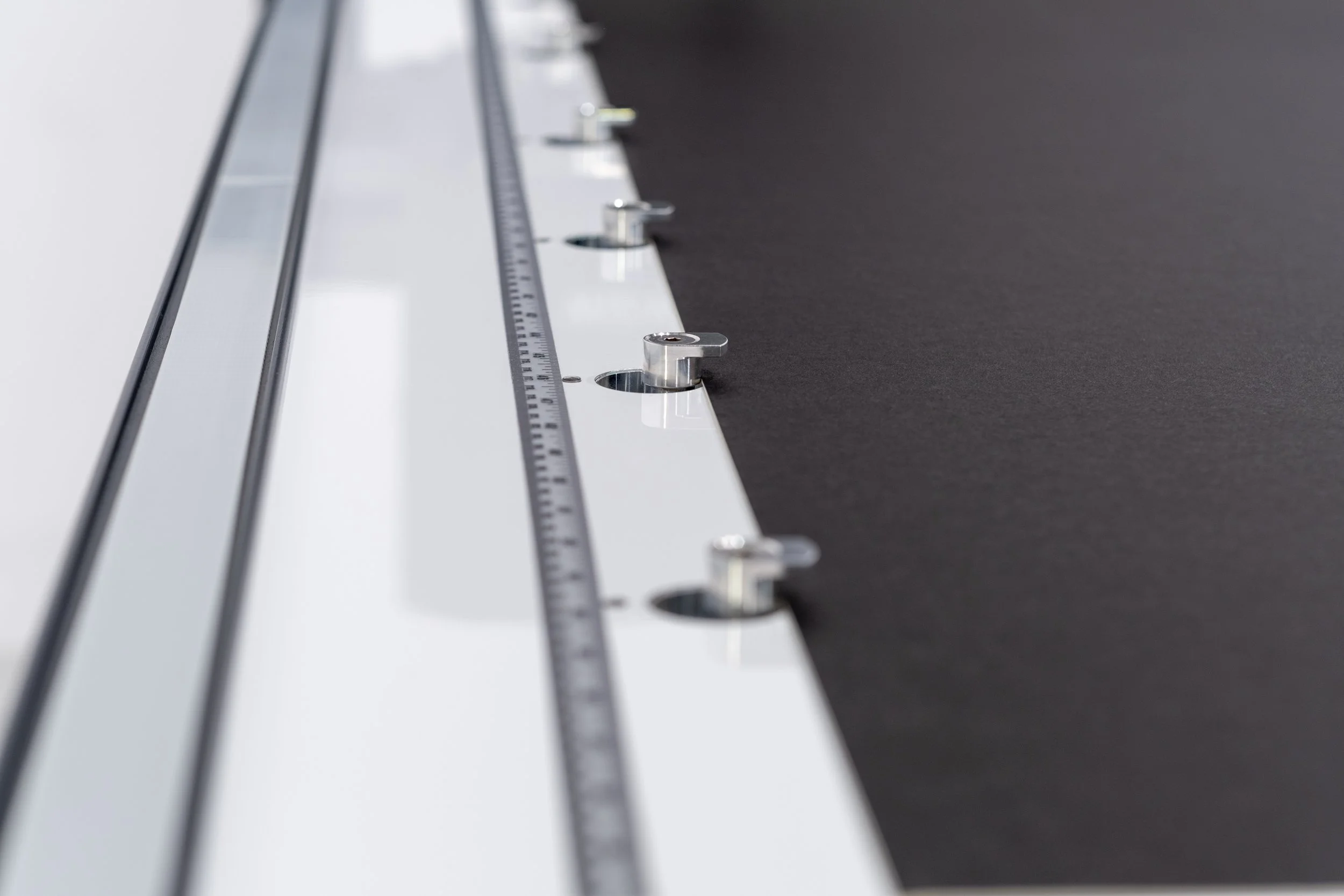 Close-up of Wizard CMC rail, ruler and positioning hardware.