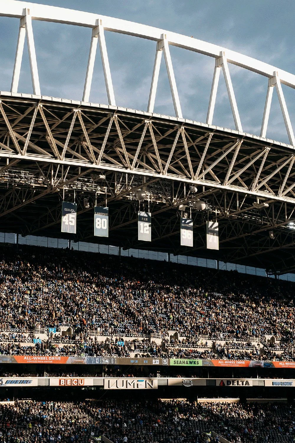 Lumen Field grandstand and roof structure filled with spectators in Seattle, Washington.