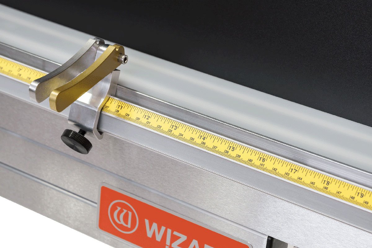 Close-up of the AirGlide material stop and yellow measurement scale.