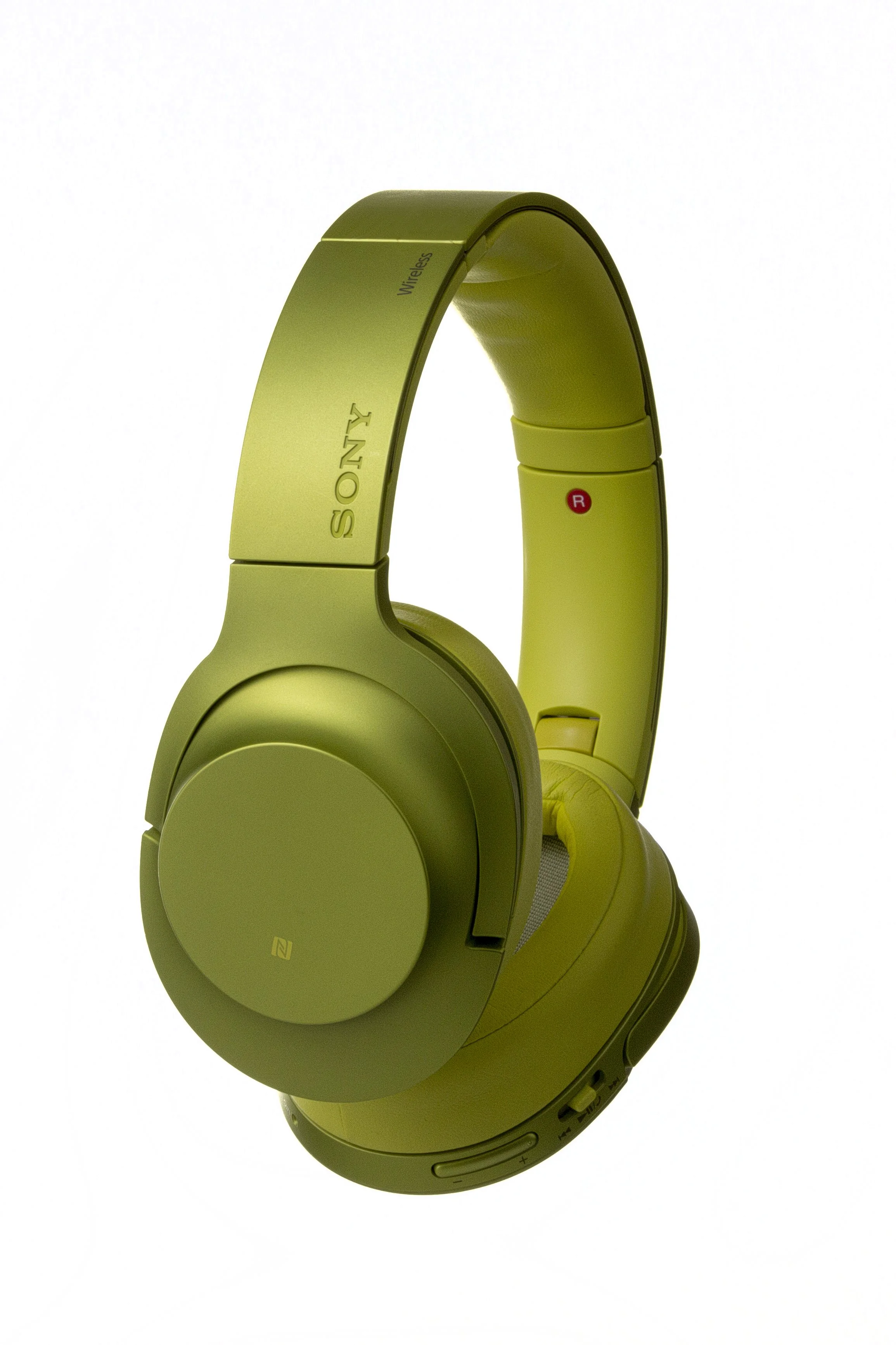 Green Sony wireless over-ear headphones with a minimalist design, showing the brand and some control buttons.