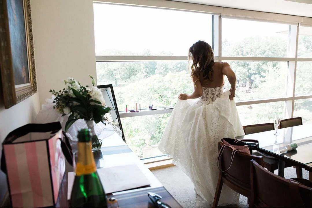 Just a girl, her bouquet, a gorgeous dress, and a bit of champagne. Getting ready for the big moment is the best part!