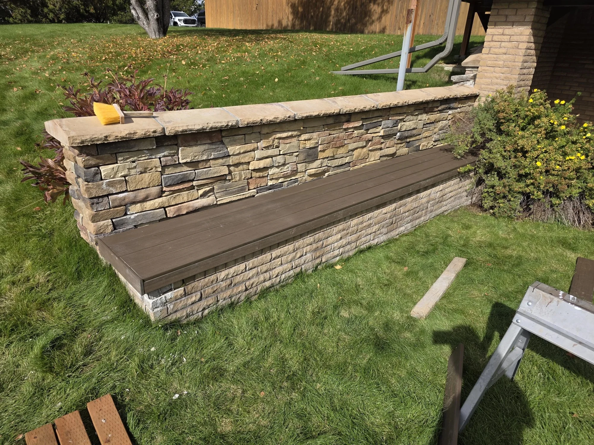 Composite decking bench covers built over brick patio planters, Butte, MT