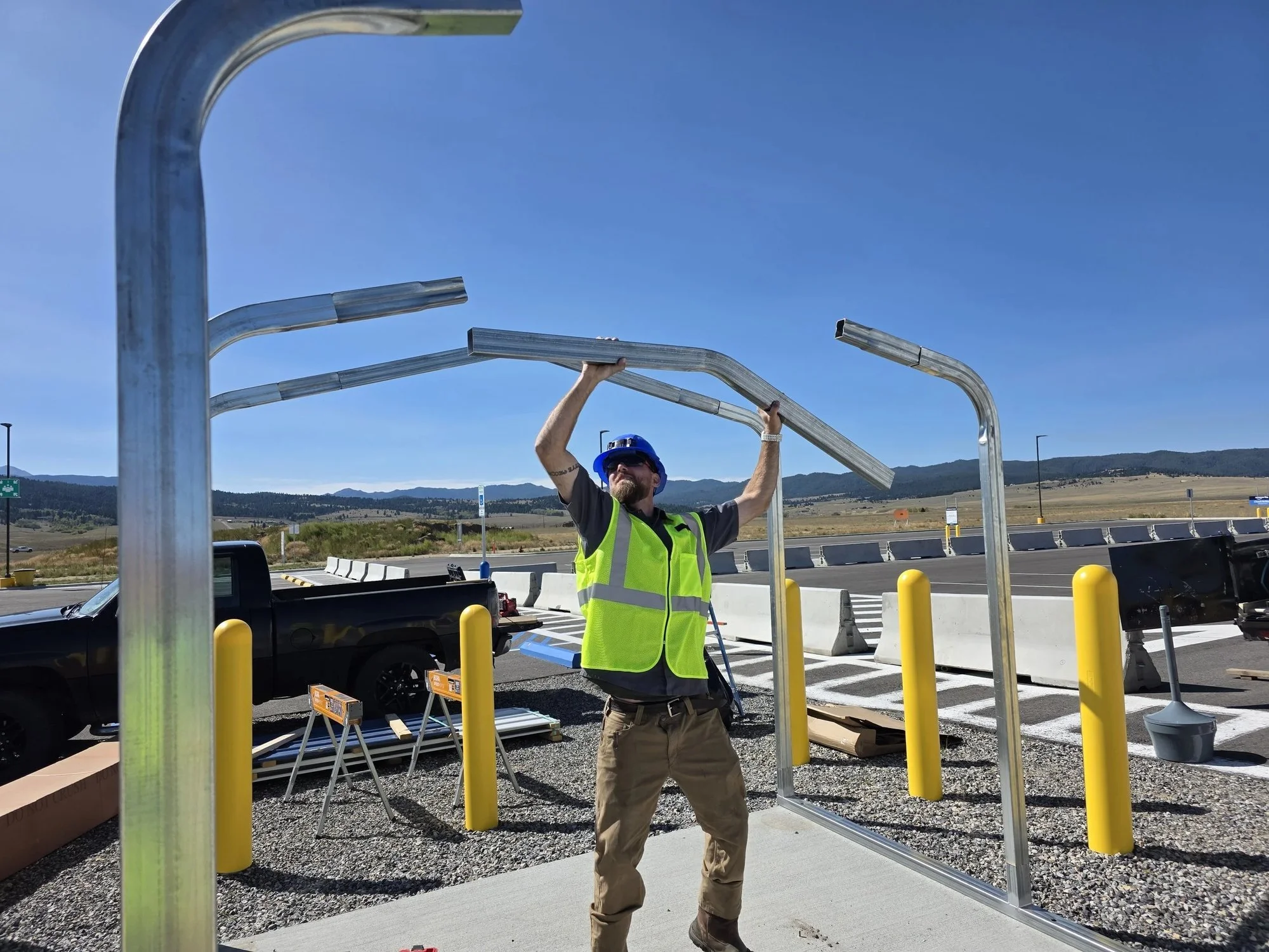 Steel shelter arches set and plumbed before the roof goes on, Butte, MT