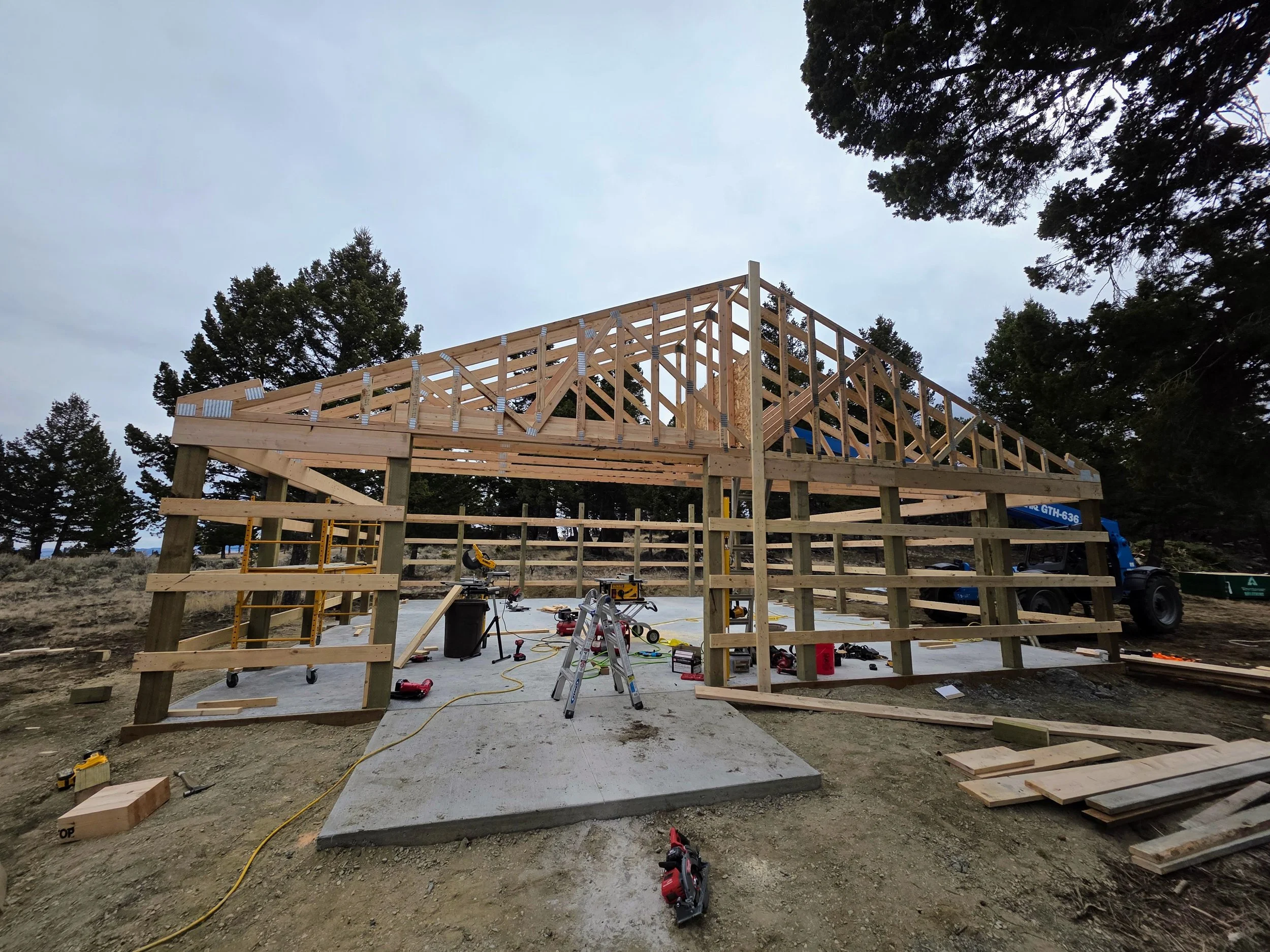 Trusses going up on the pole barn shop, Whitehall, Montana