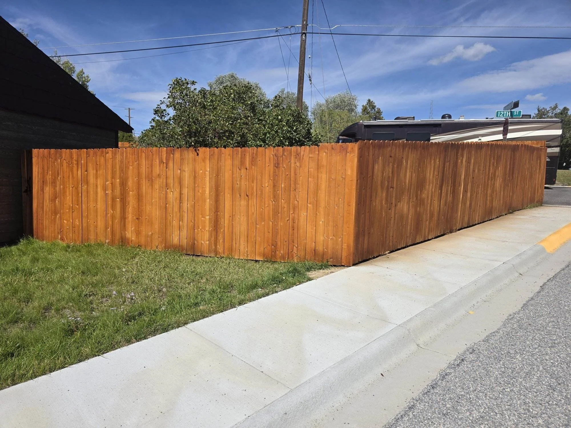 Cedar privacy fence built in May and stained in October, Walkerville, MT