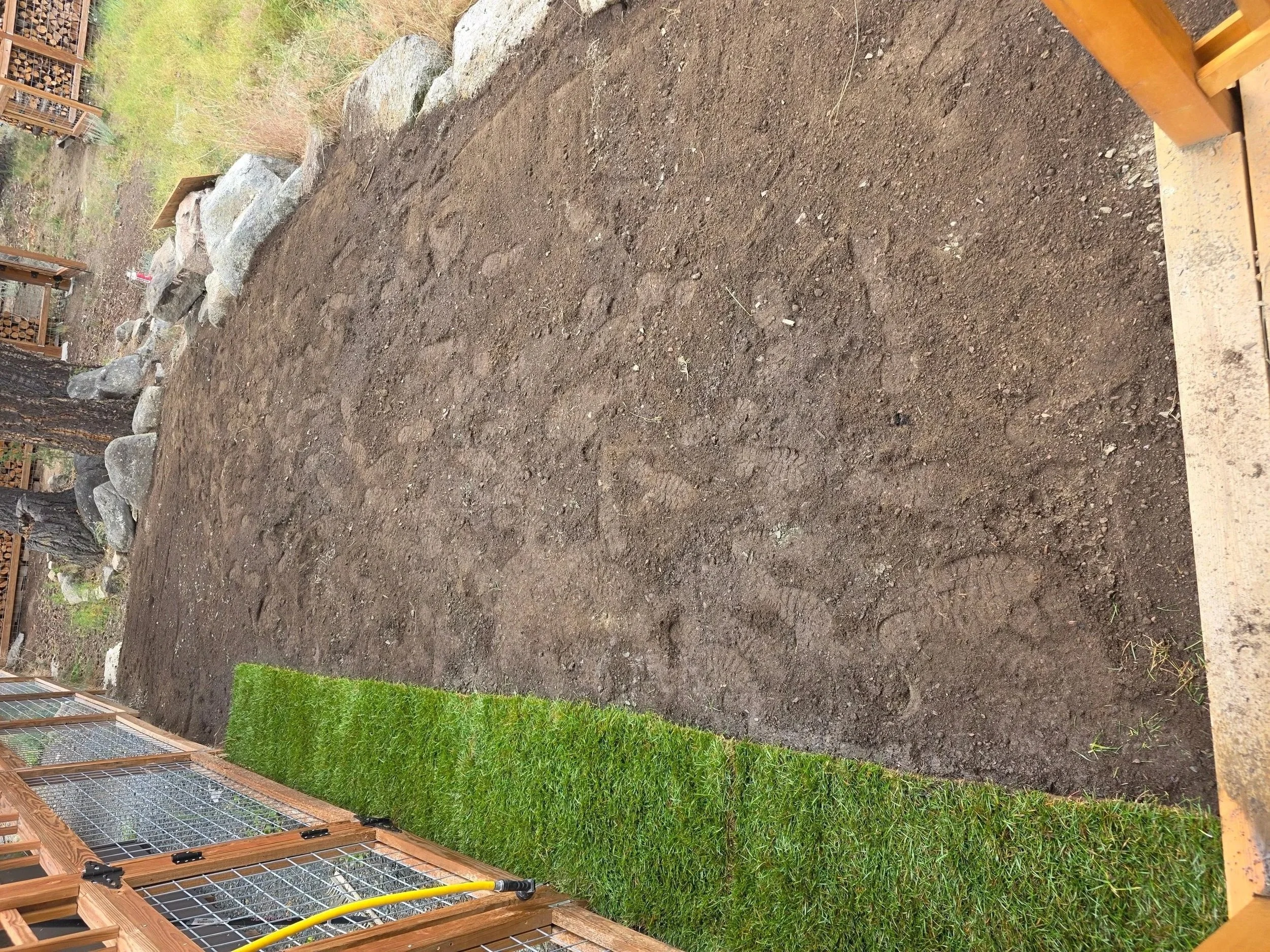 First row of sod laid along the deck on a graded slope, Whitehall, Montana