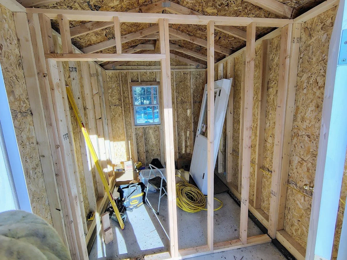 Partition wall framed inside the pre-built cabin for the coop, Pipestone, Montana