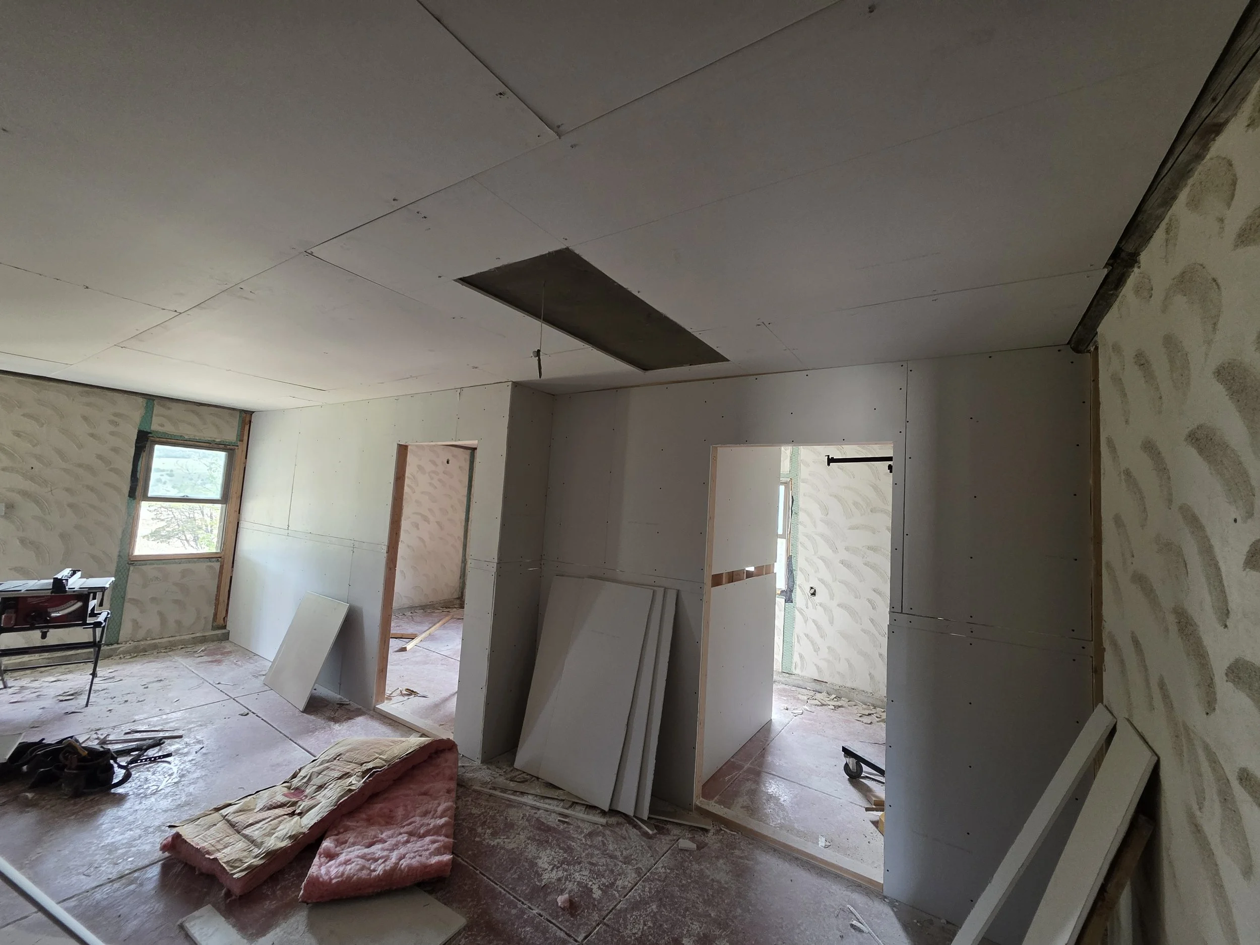 New drywall going up over the old plaster walls in the Cardwell, Montana bunkhouse