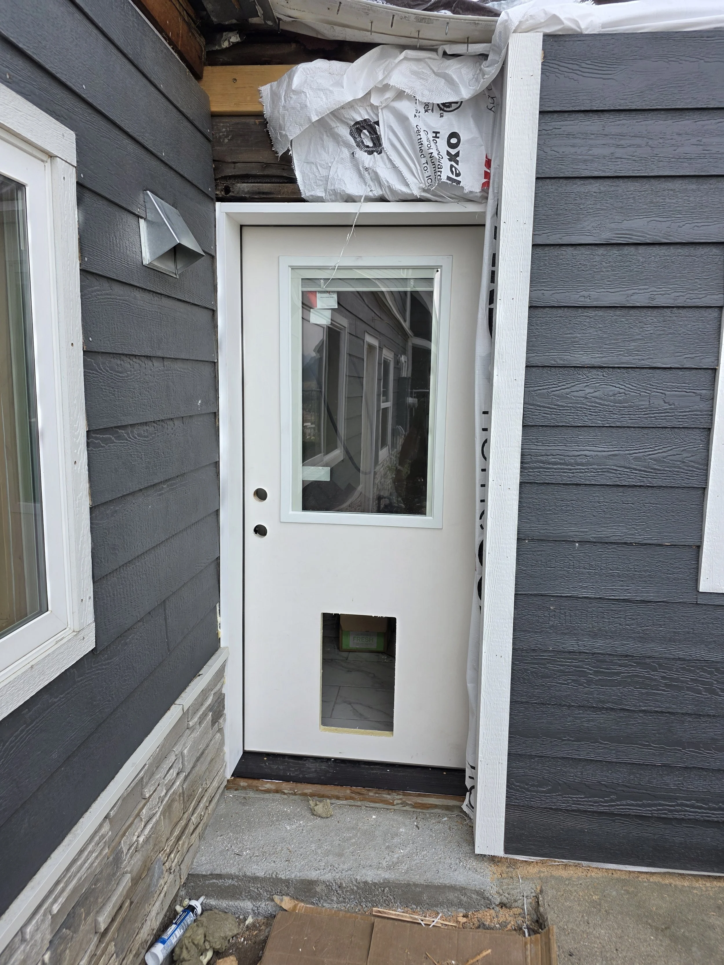 New entry door set in the sided addition, Uptown Butte, Montana