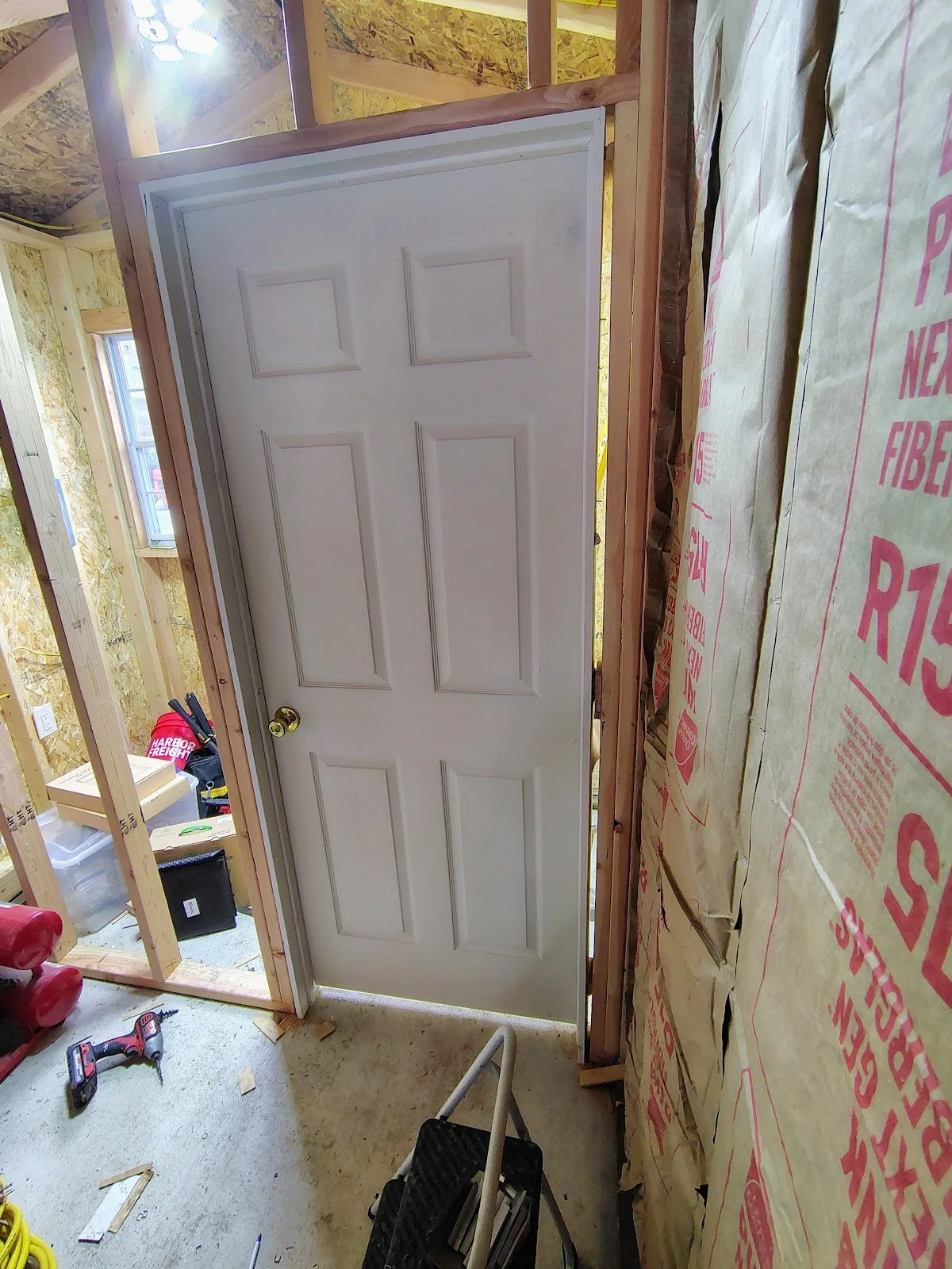 Interior door set in the new partition wall, Pipestone, Montana
