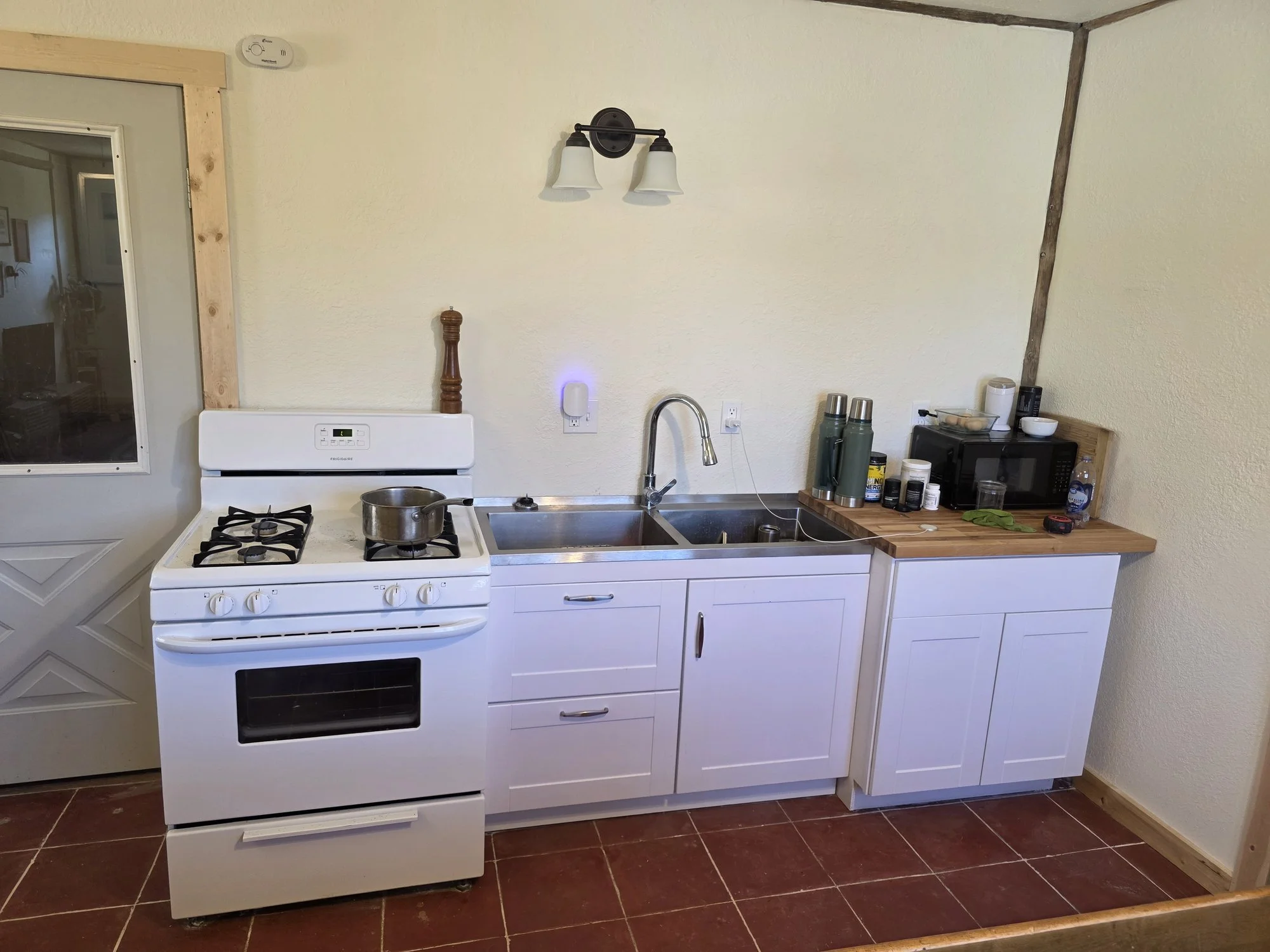 New kitchen cabinets installed in a Cardwell, Montana bunkhouse remodel
