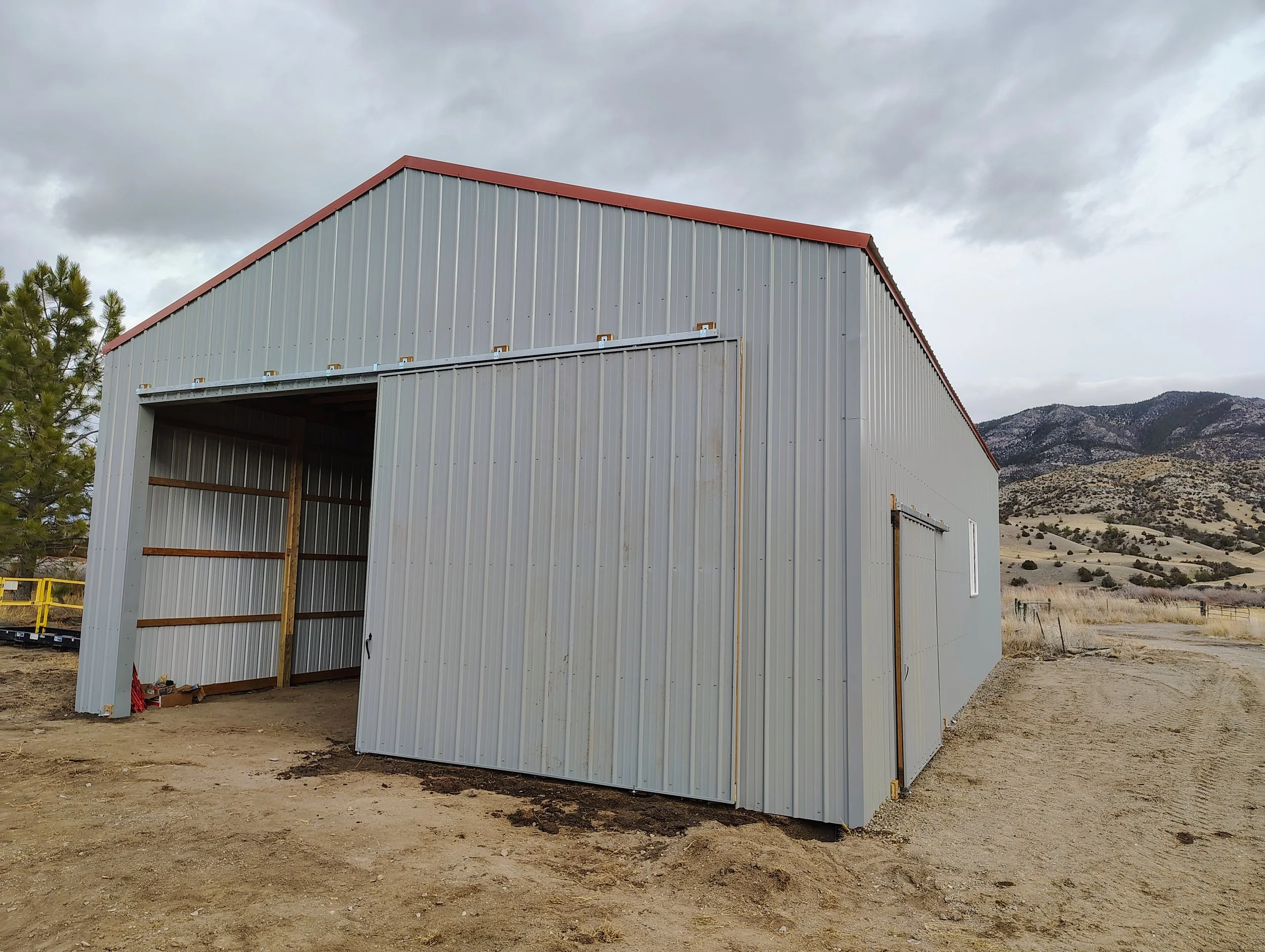 Finished ranch pole barn with a sliding door, Cardwell, Montana