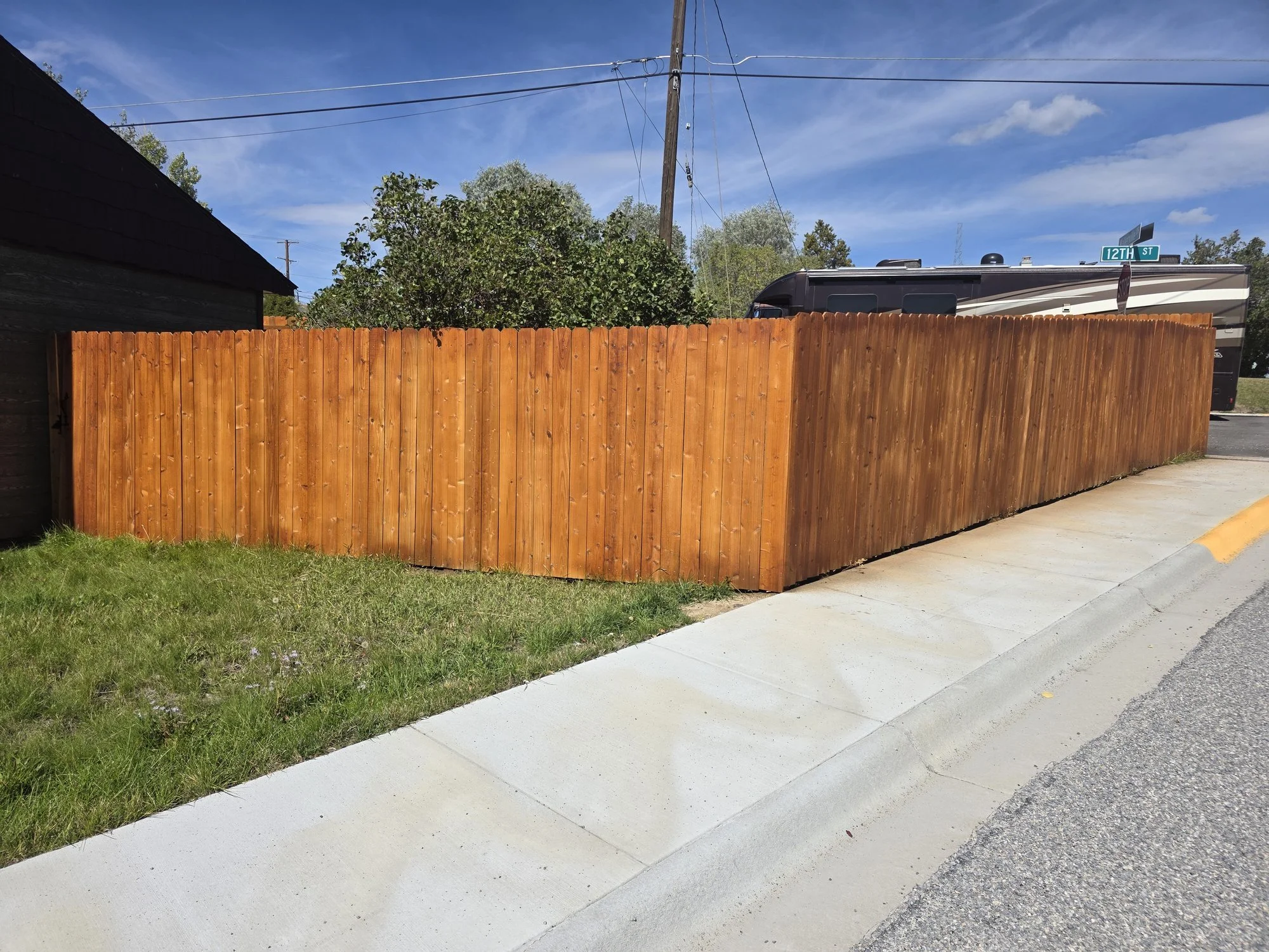 Cedar privacy fence built in May and stained in October, Walkerville, MT