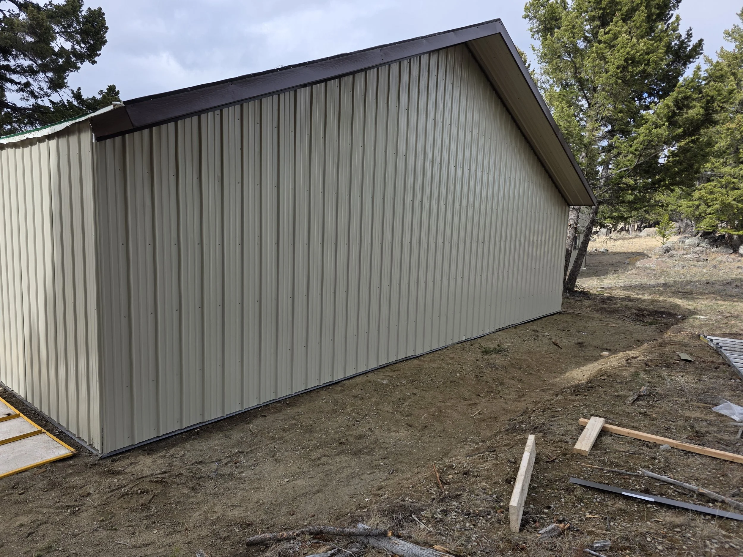 Steel siding finished on the side of the pole barn shop, Whitehall, Montana