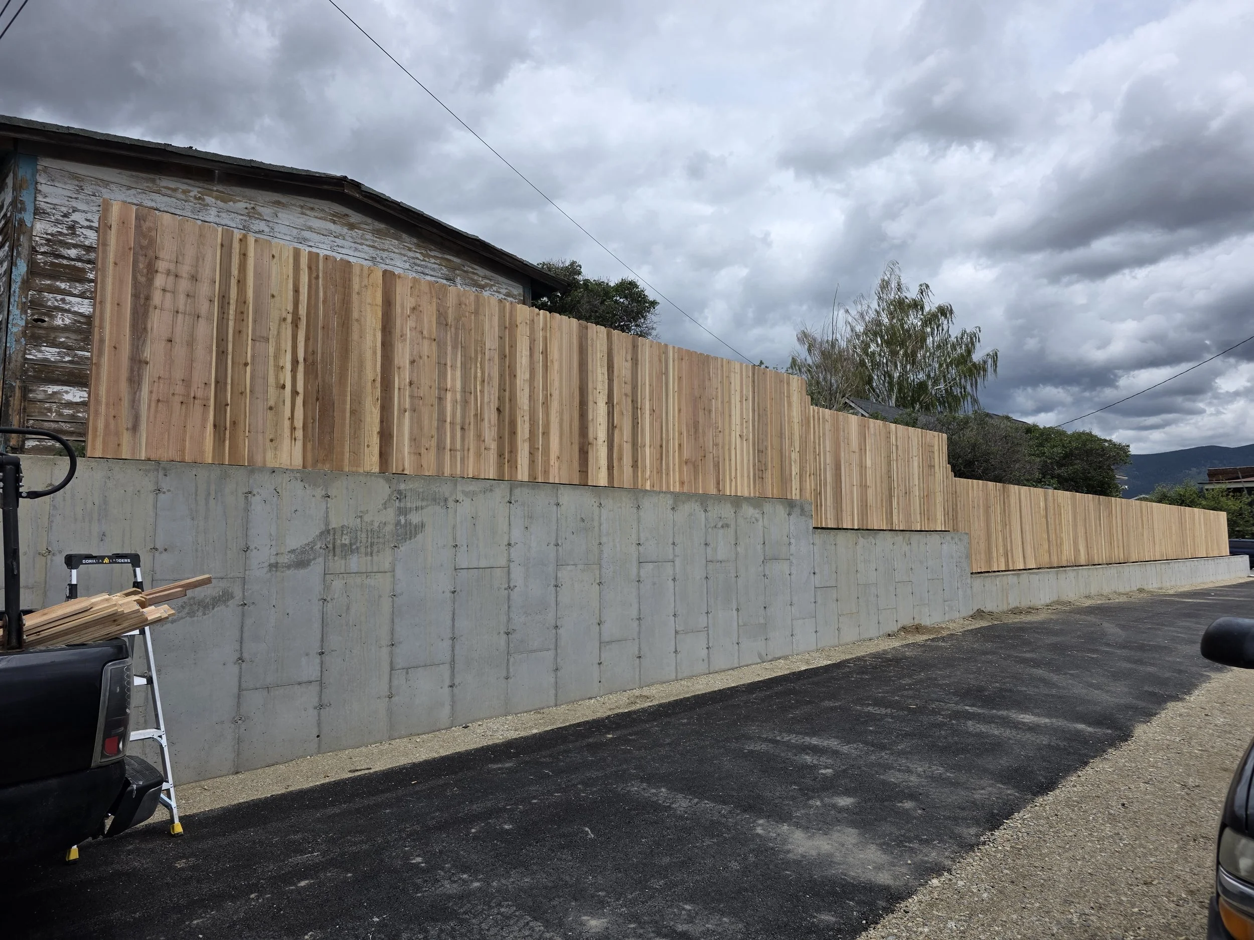 Finished cedar fence along the top of the retaining wall, Uptown Butte, Montana