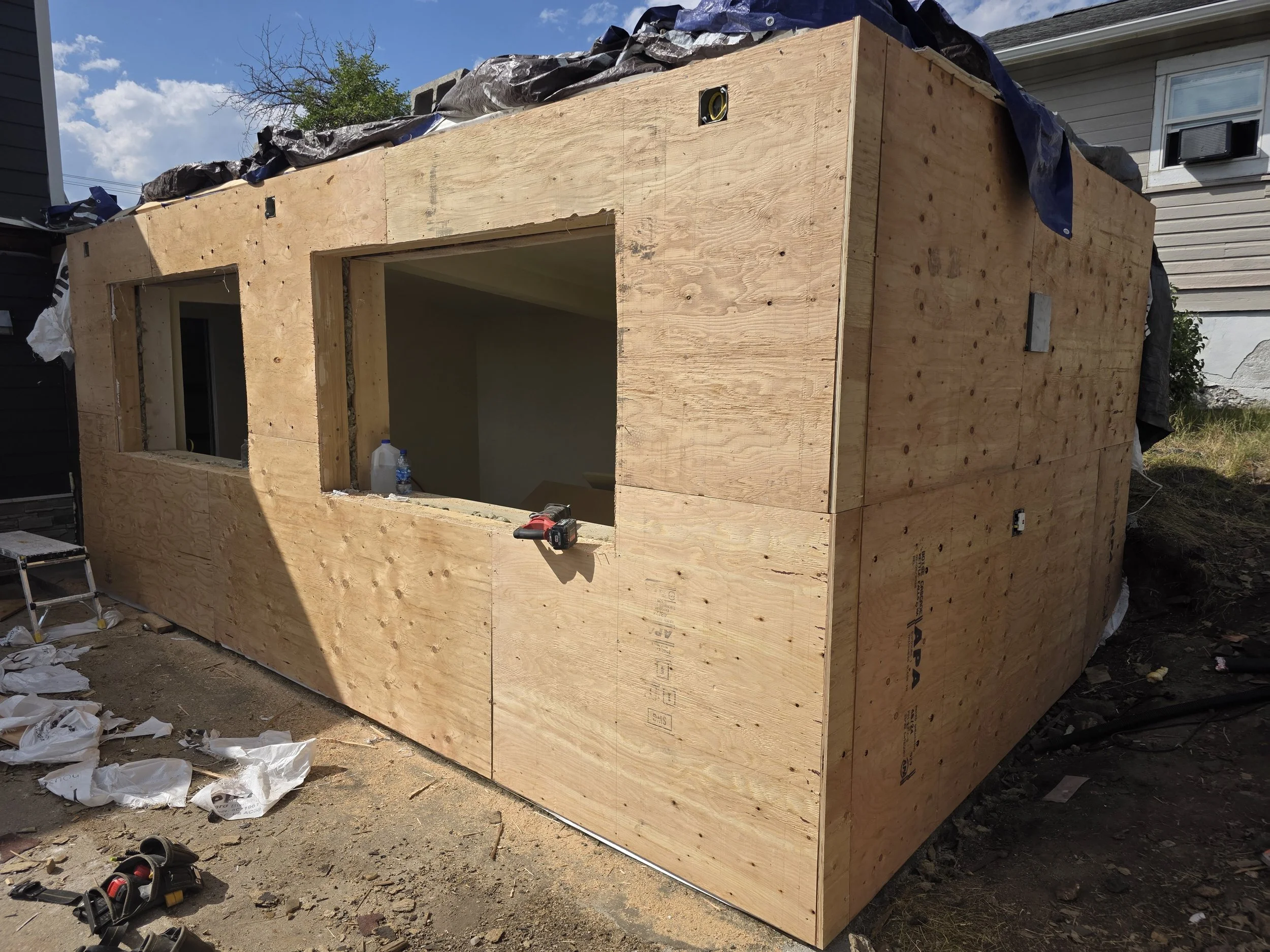 Sheathed addition with the new window openings cut in, Uptown Butte, Montana