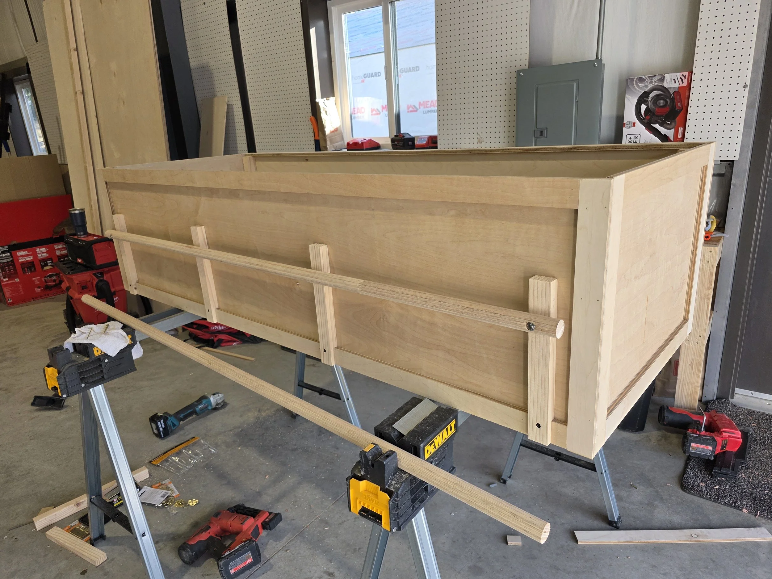 Trim and carry rails being fitted to the casket, Butte, Montana