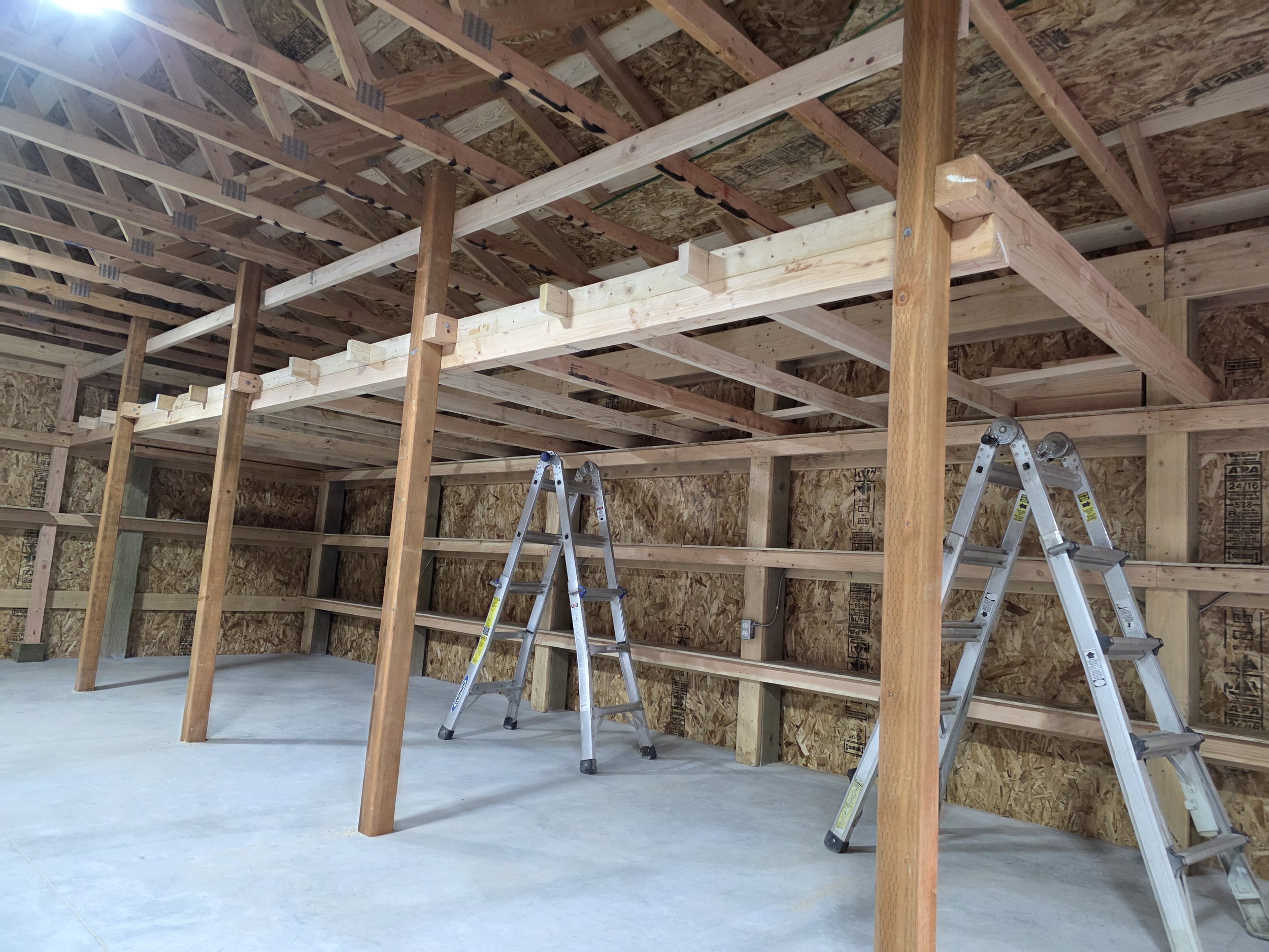 Loft framing inside the pole barn shop, Whitehall, Montana