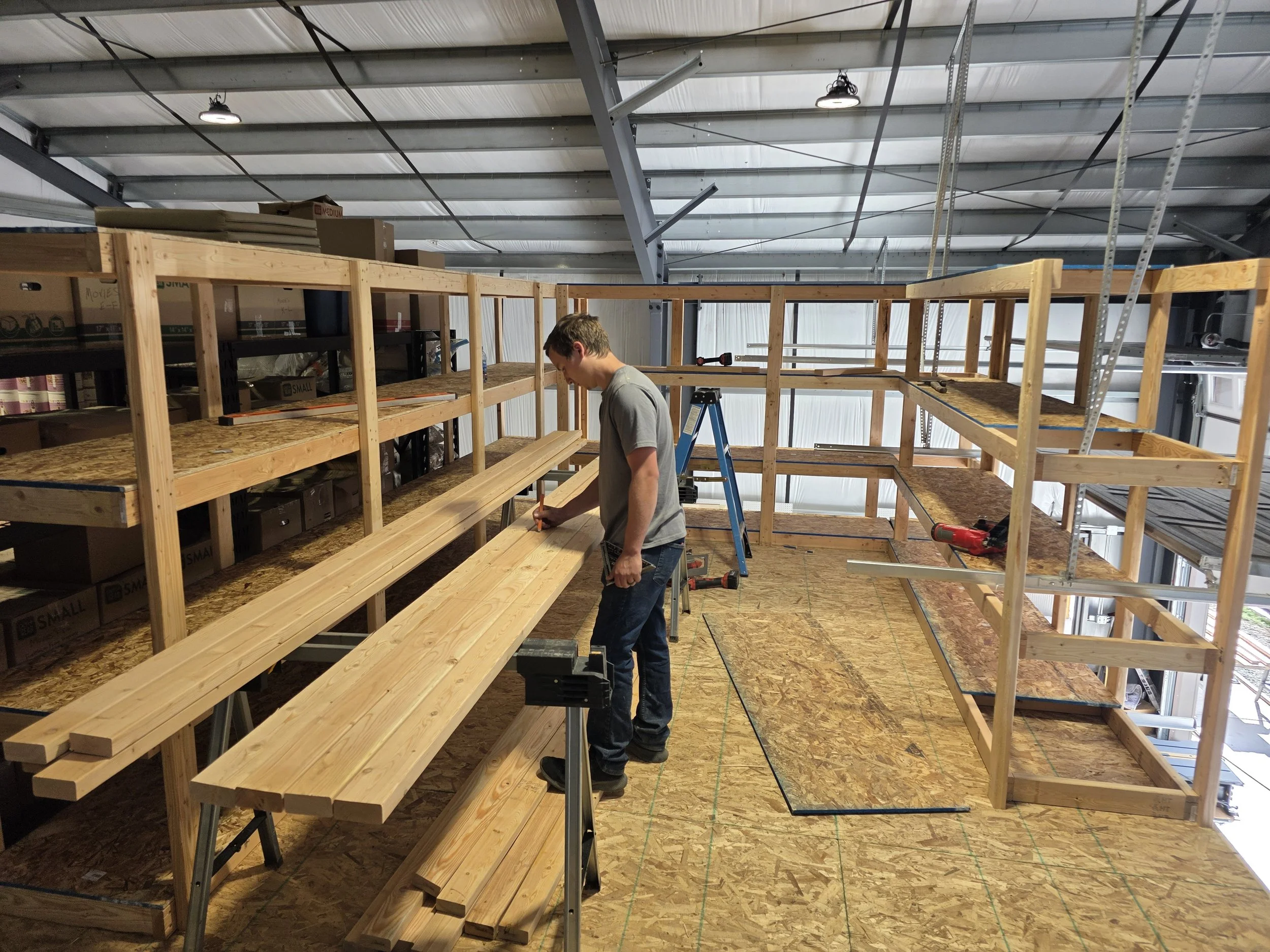 Building storage shelving on the mezzanine floor, Opportunity, Montana