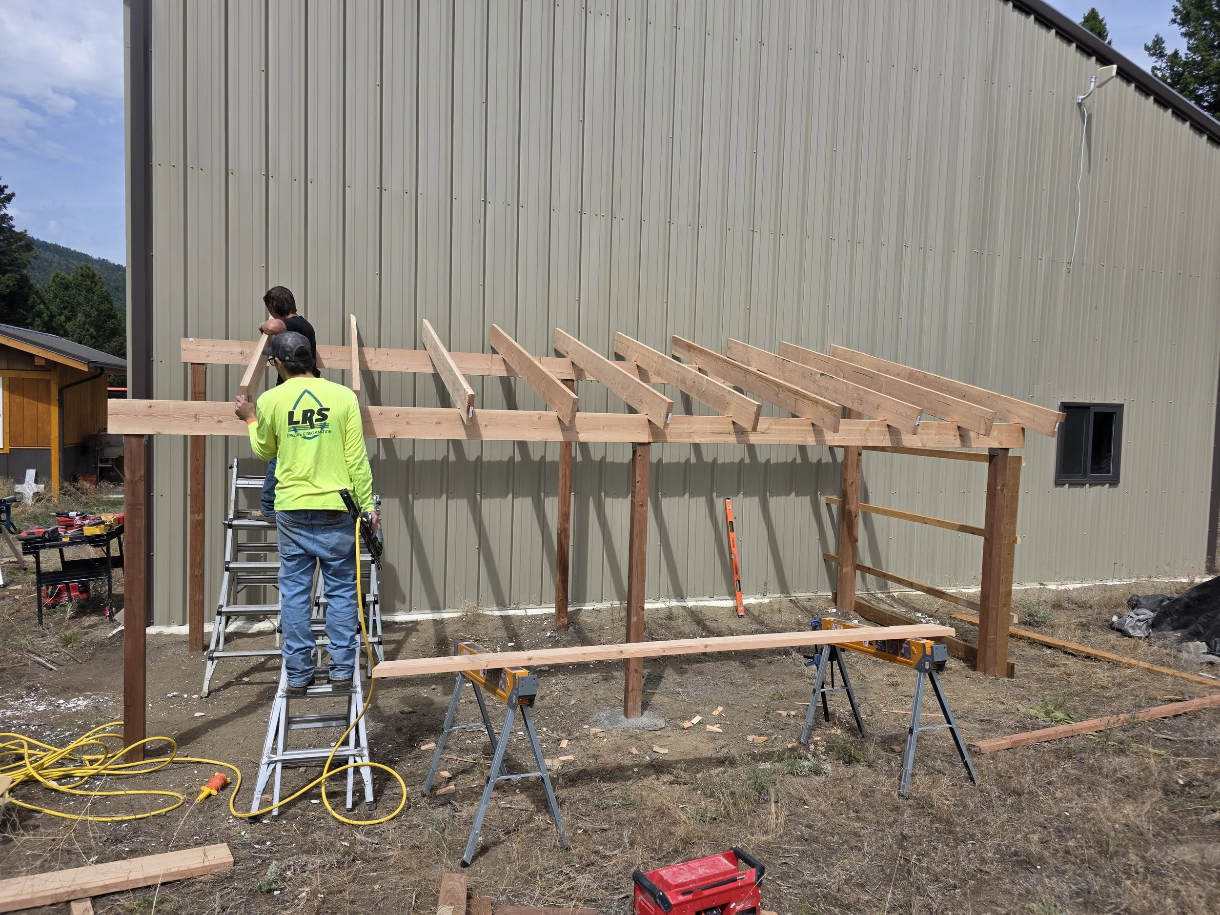 Wooden lean-to outbuilding shed in Whitehall, MT.