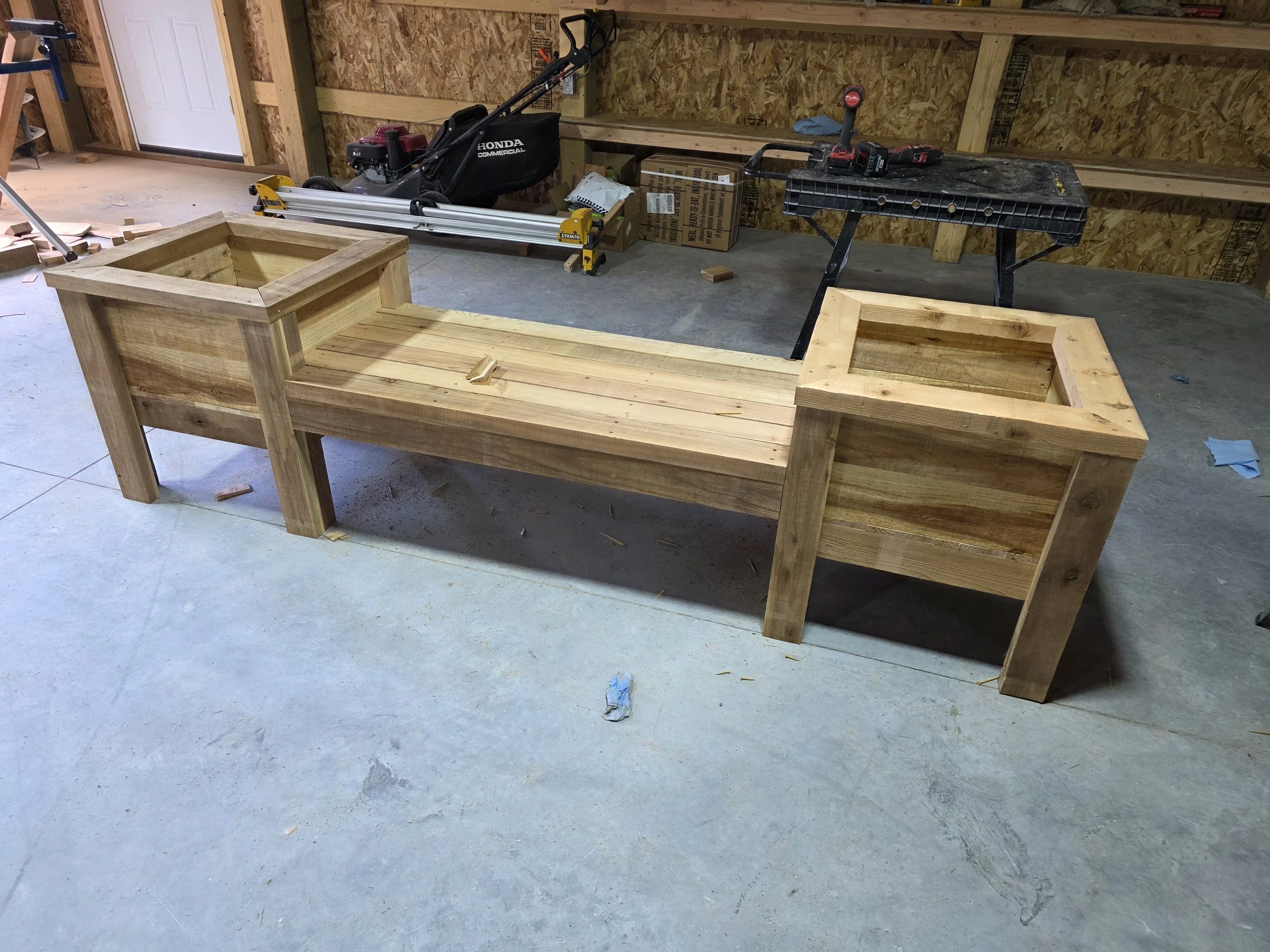Cedar bench seat with planter boxes on both ends, built in the shop