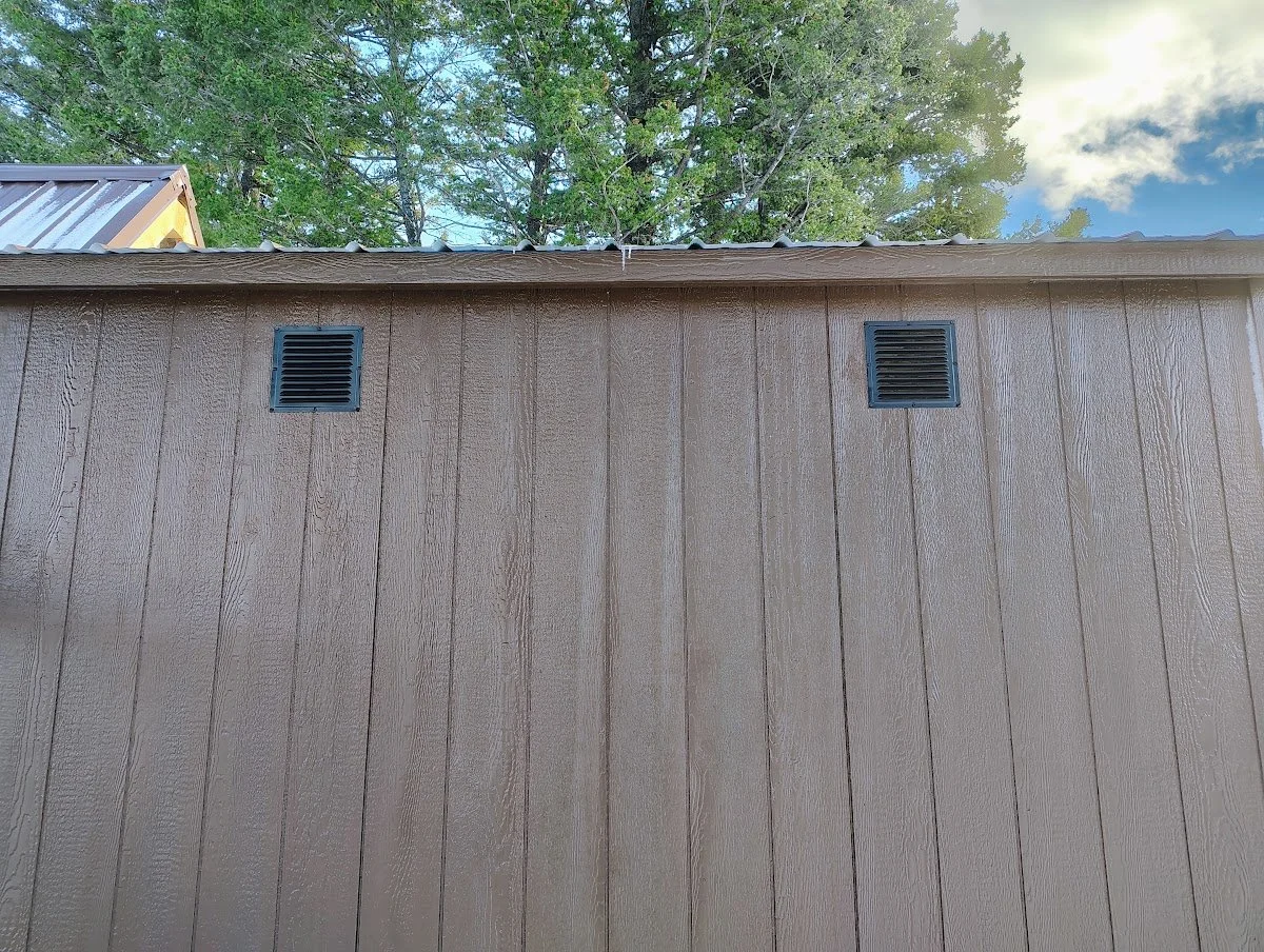 Vents cut into the coop siding, Pipestone, Montana