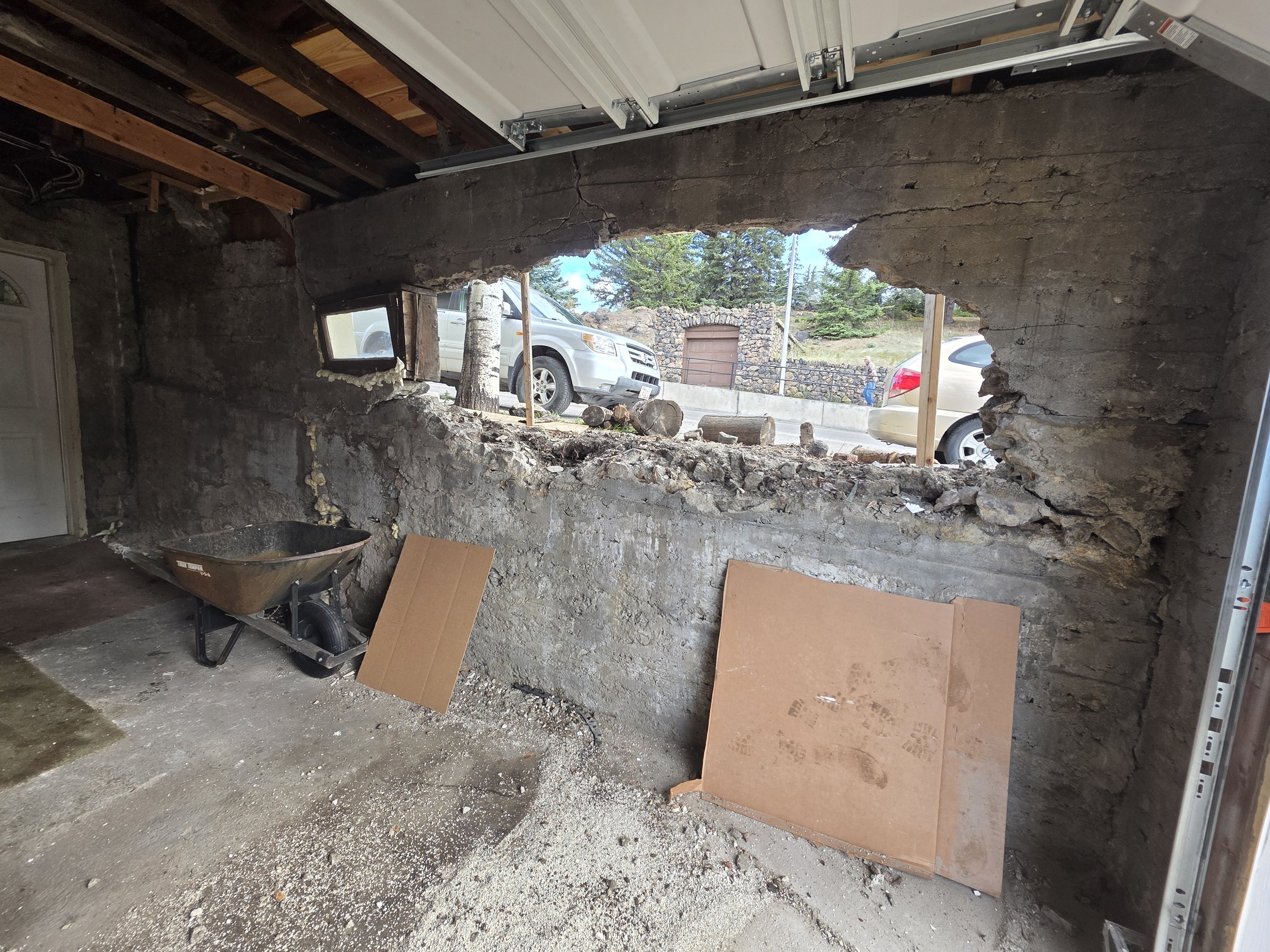 Inside the garage looking out through the damaged rock wall, Butte, Montana