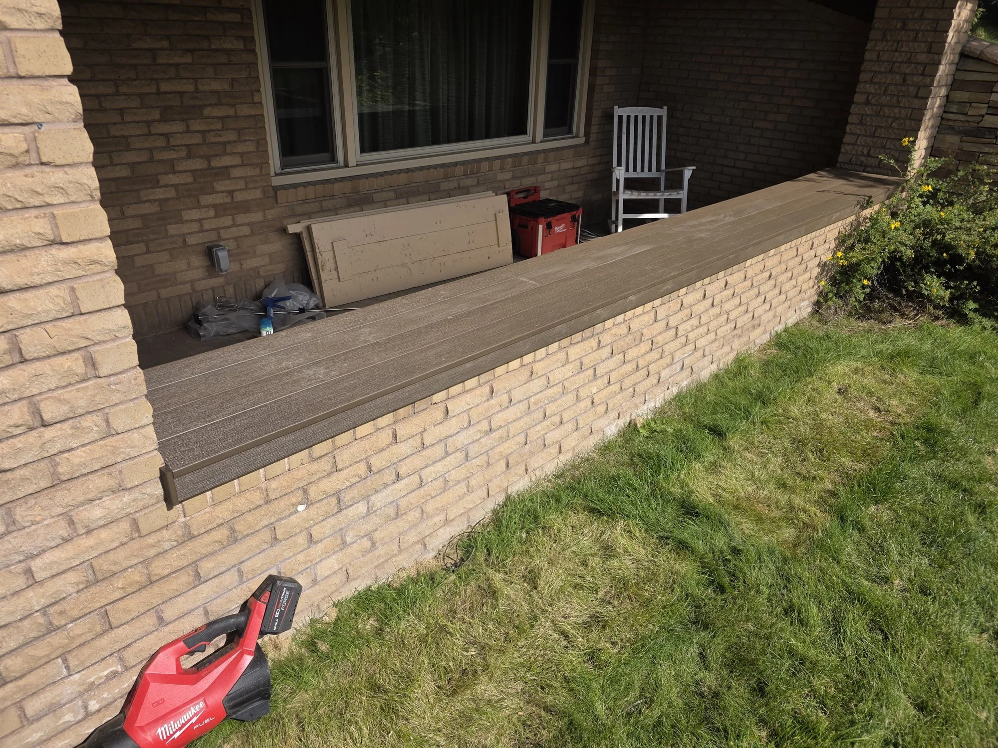 Side view of the composite planter bench cap with a trim board hiding the cut ends, Butte, MT