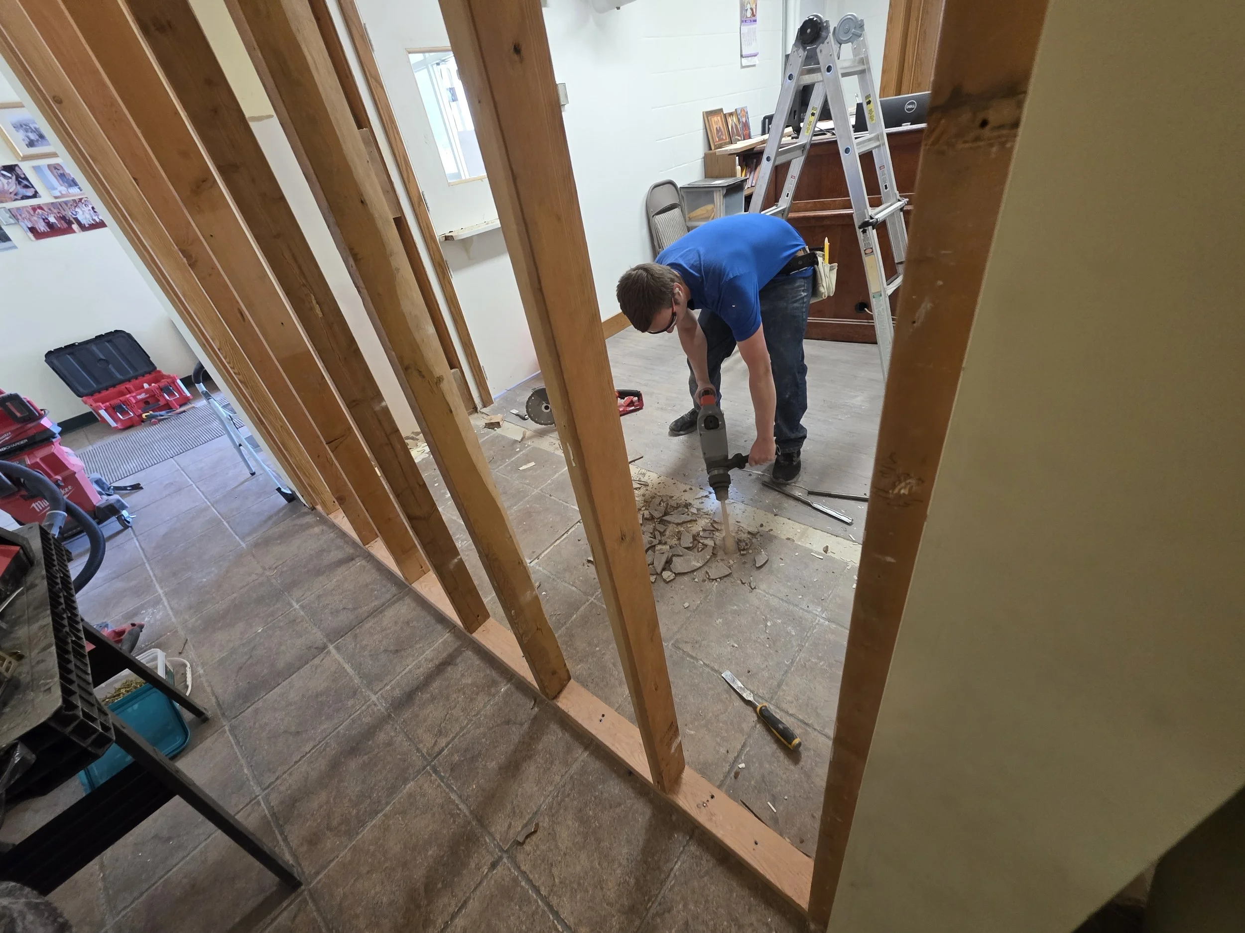 Framing the new wall between the church hallway and office, Butte, Montana