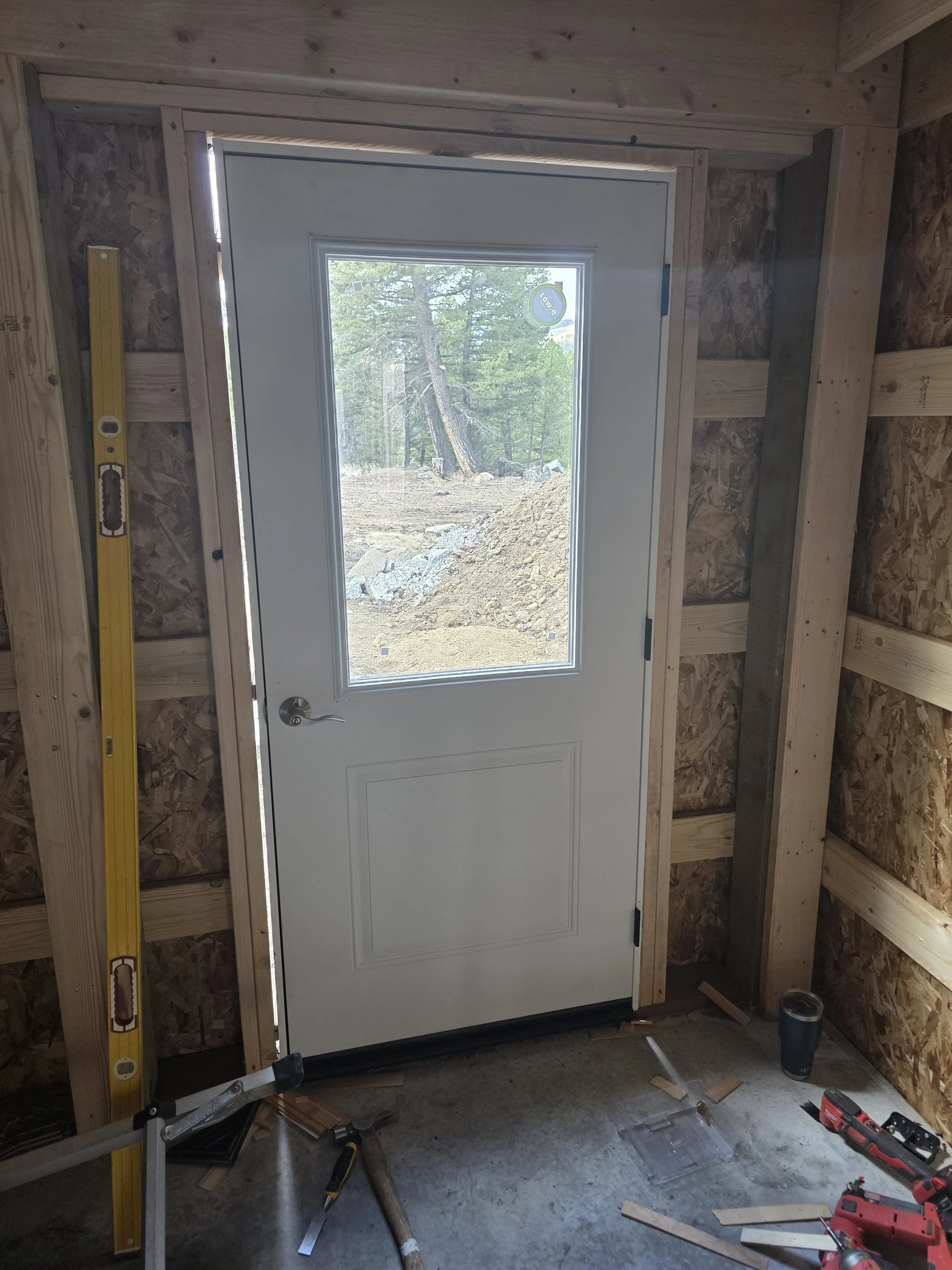 Entry door set in the pole barn shop, inside view, Whitehall, Montana