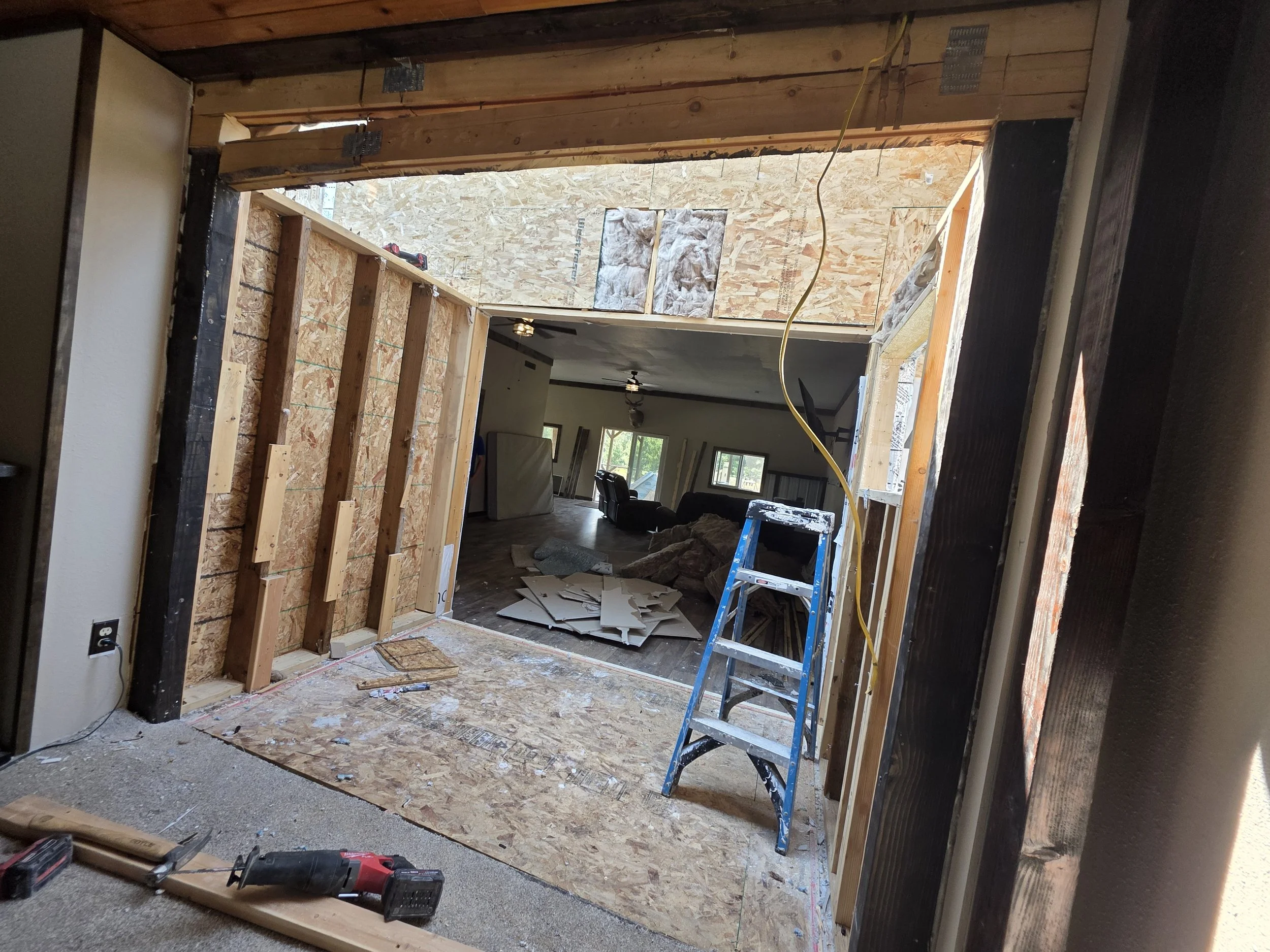 Addition walls opened up mid tear-out, looking into the main house, Whitehall, Montana