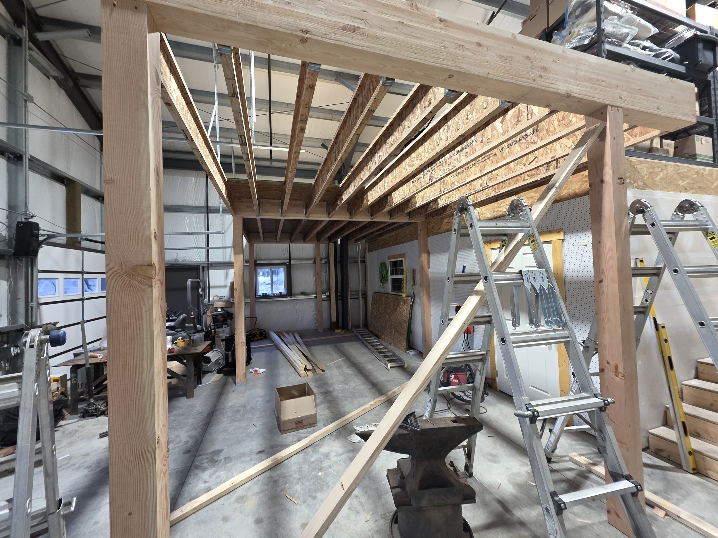 Mezzanine floor joists framed inside the steel shop, Opportunity, Montana
