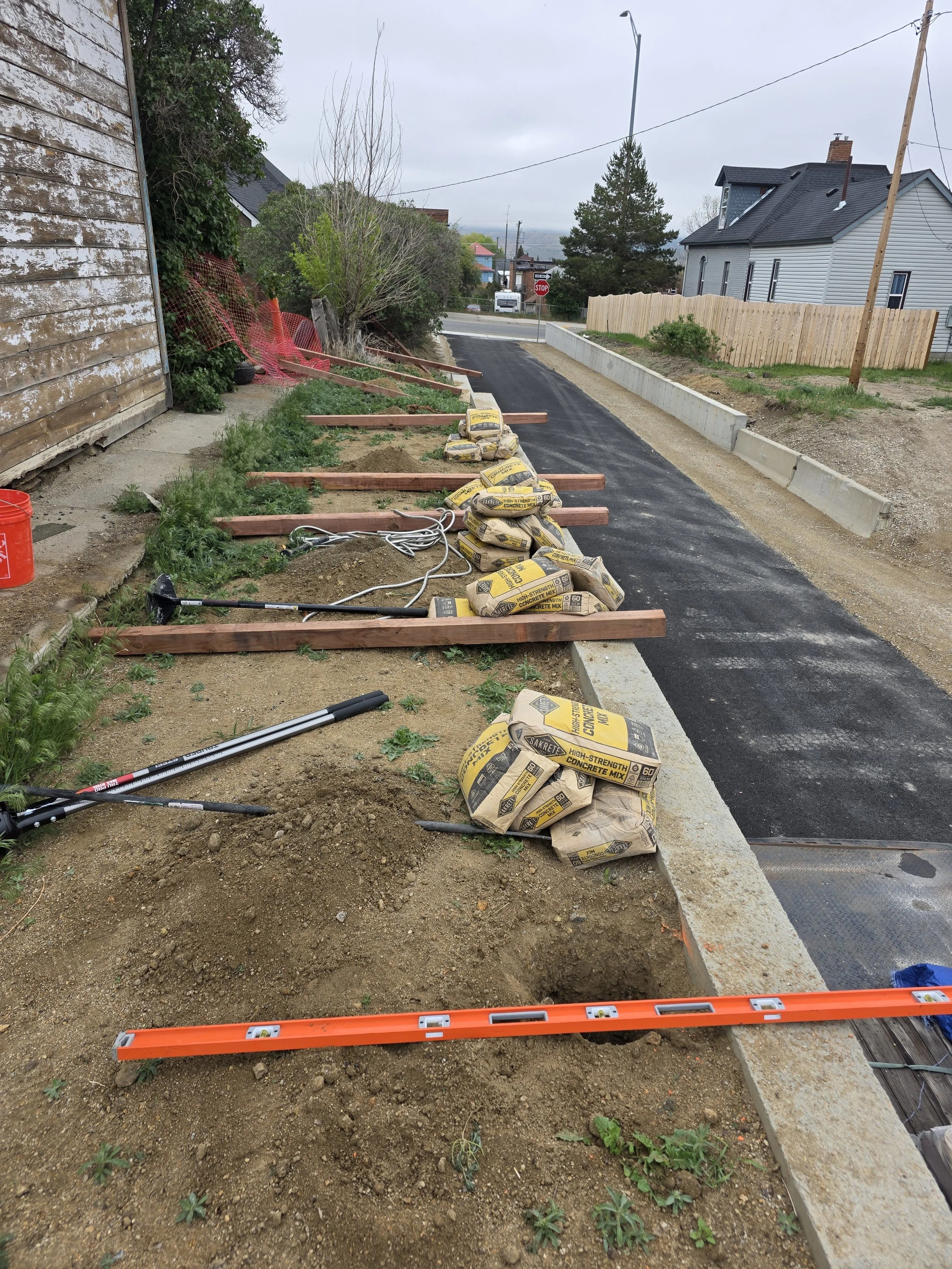 Fence post layout along the top of a concrete retaining wall, Uptown Butte, Montana