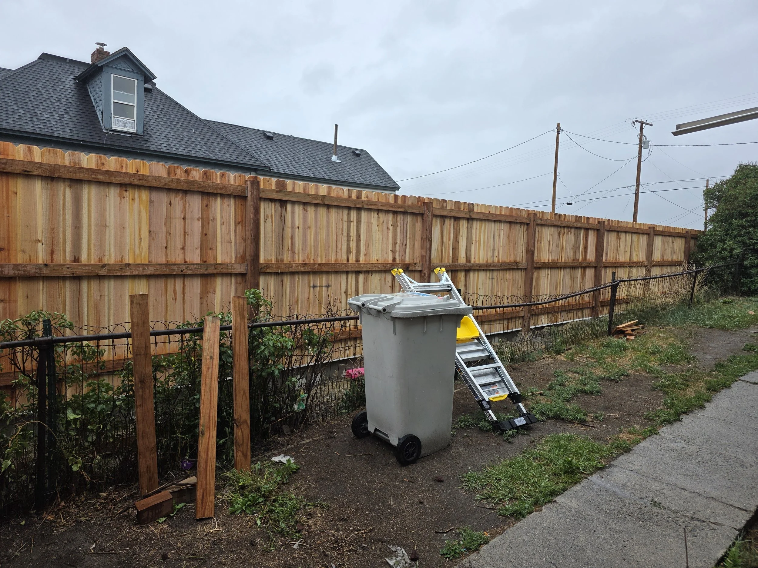 Yard side of the finished cedar privacy fence, Uptown Butte, Montana