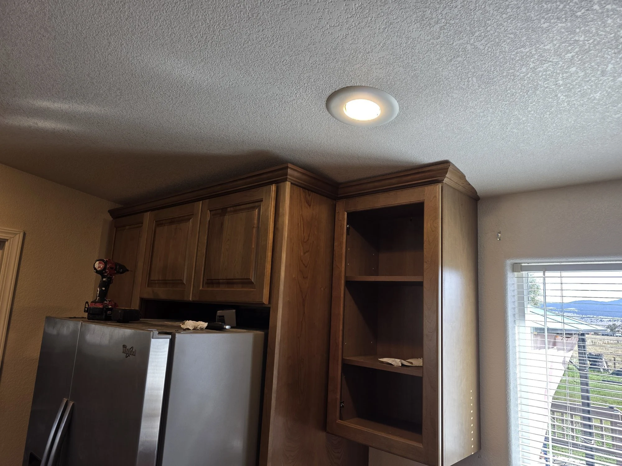 Stained crown molding installed on the upper cabinets, Anaconda kitchen