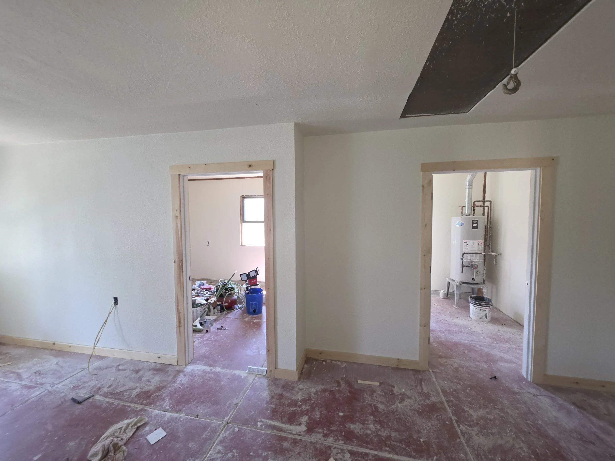 New bedroom and laundry doorways drywalled and primed, Cardwell, Montana bunkhouse
