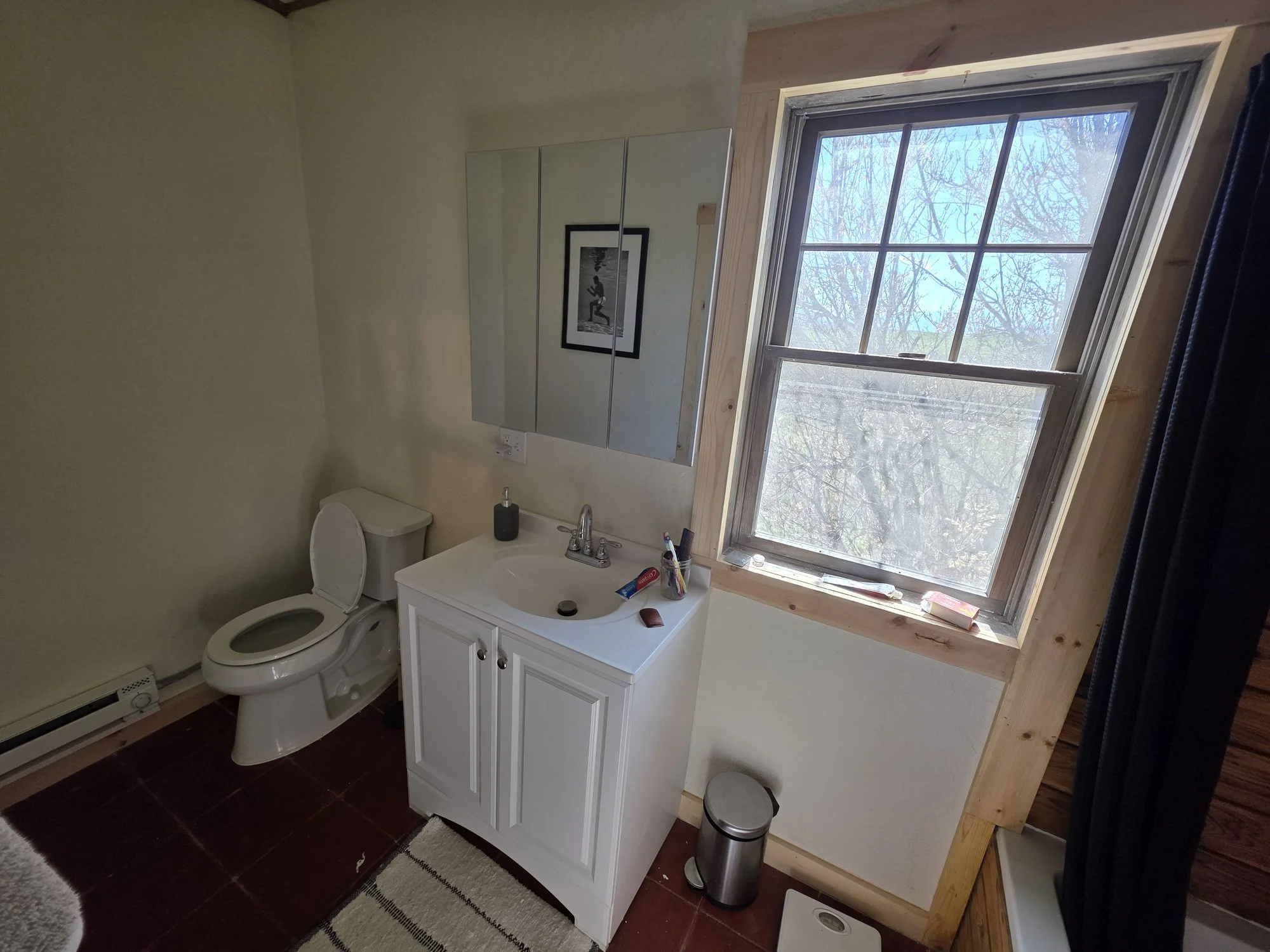 New bathroom vanity and window trim in a renovated Cardwell, Montana bunkhouse