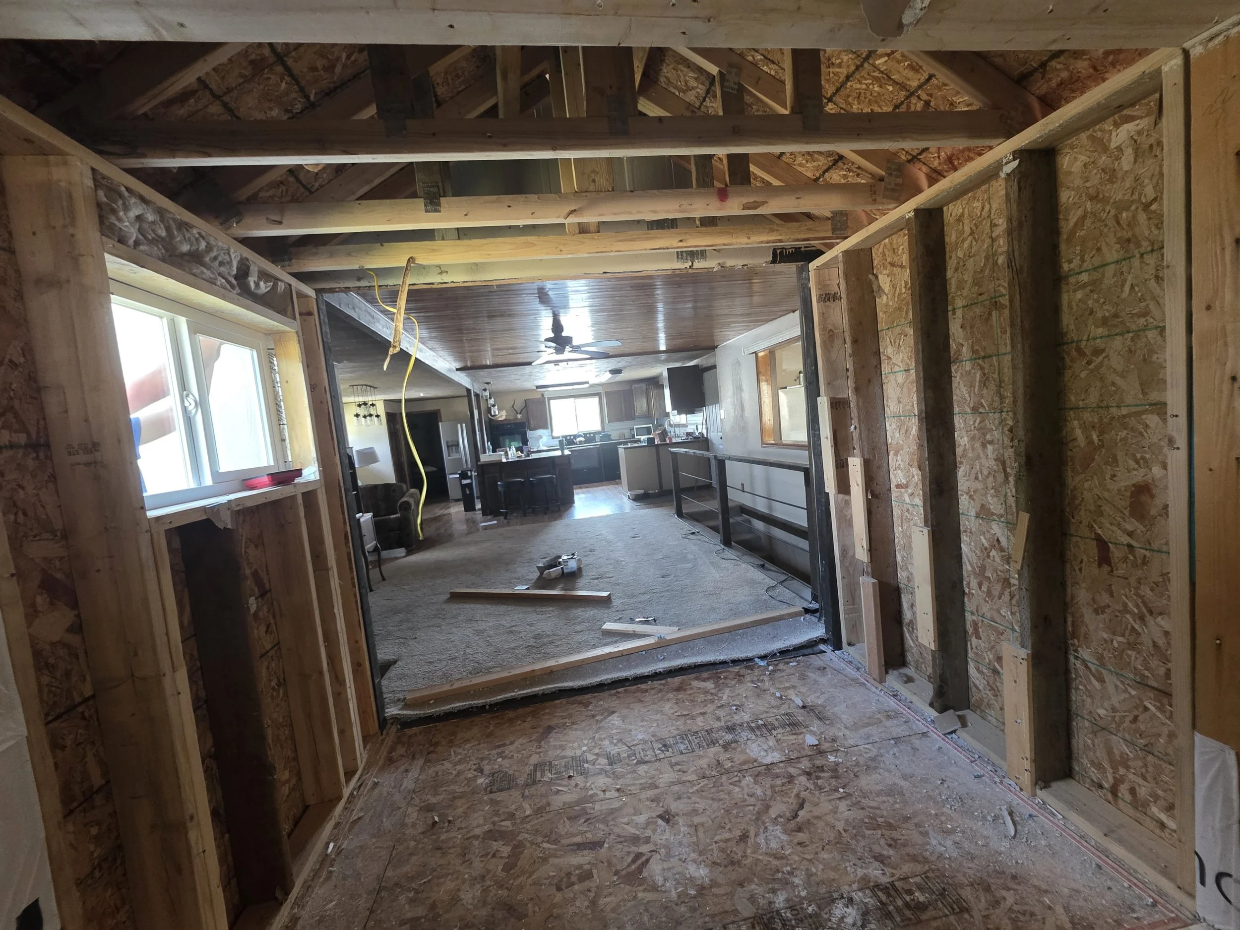 Breezeway addition stripped to the framing before the tear-out, Whitehall, Montana