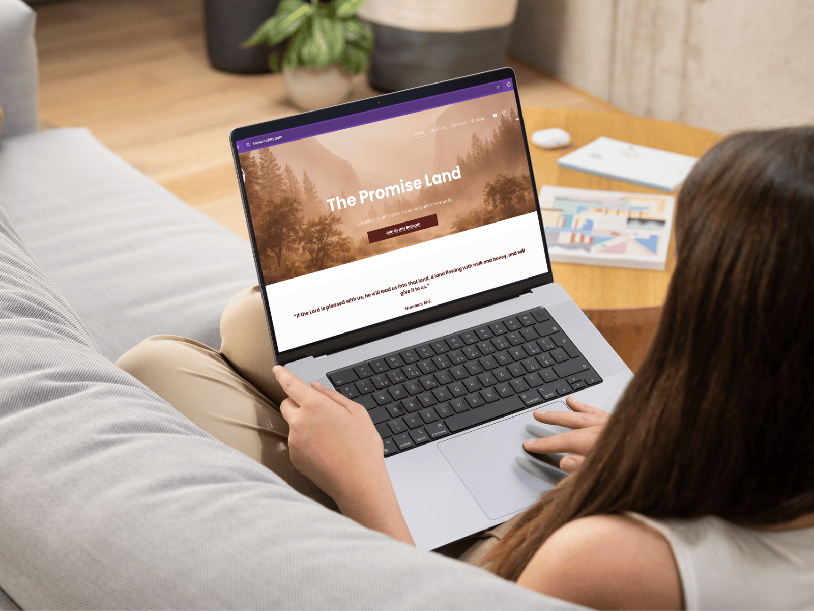 The Promise Land website design displayed on a laptop
